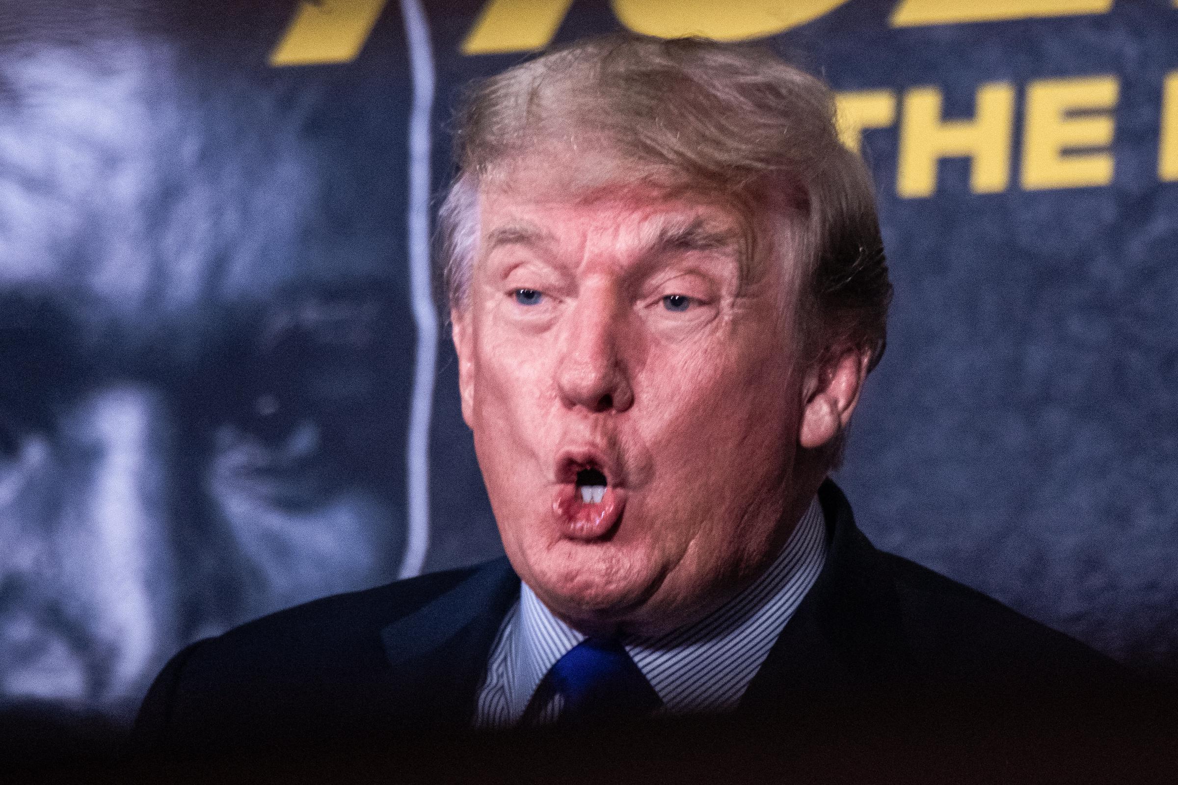 Donald Trump's hair appears darker and more muted than his earlier golden-blond look as he provides commentary at the Holyfield vs. Belfort boxing event in Hollywood, Florida, on September 11, 2021.