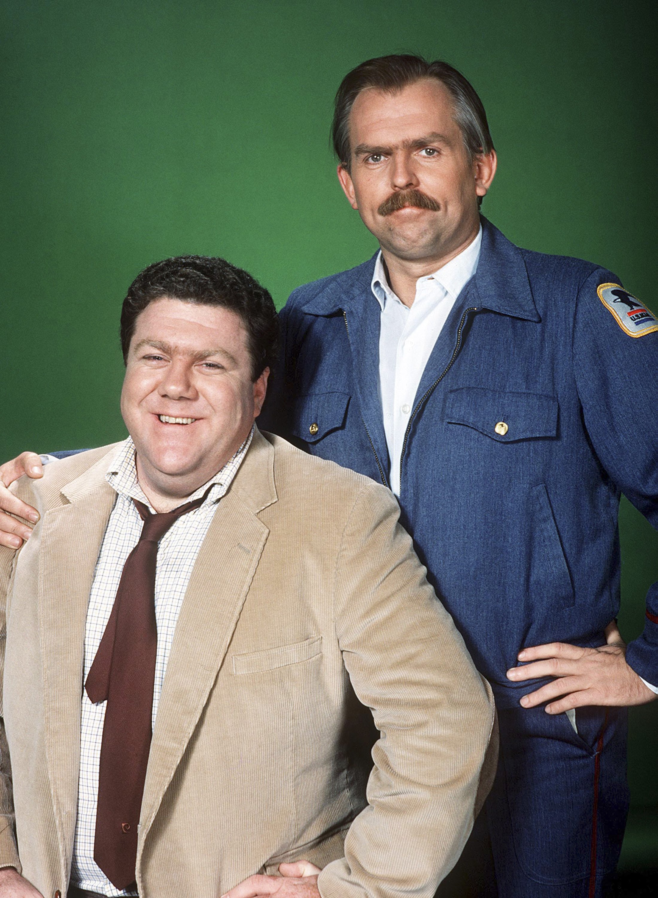 George Wendt and John Ratzenberger pose as Norm Peterson and Cliff Clavin in a promotional portrait for the 1982 sitcom "Cheers" | Source: Getty Images