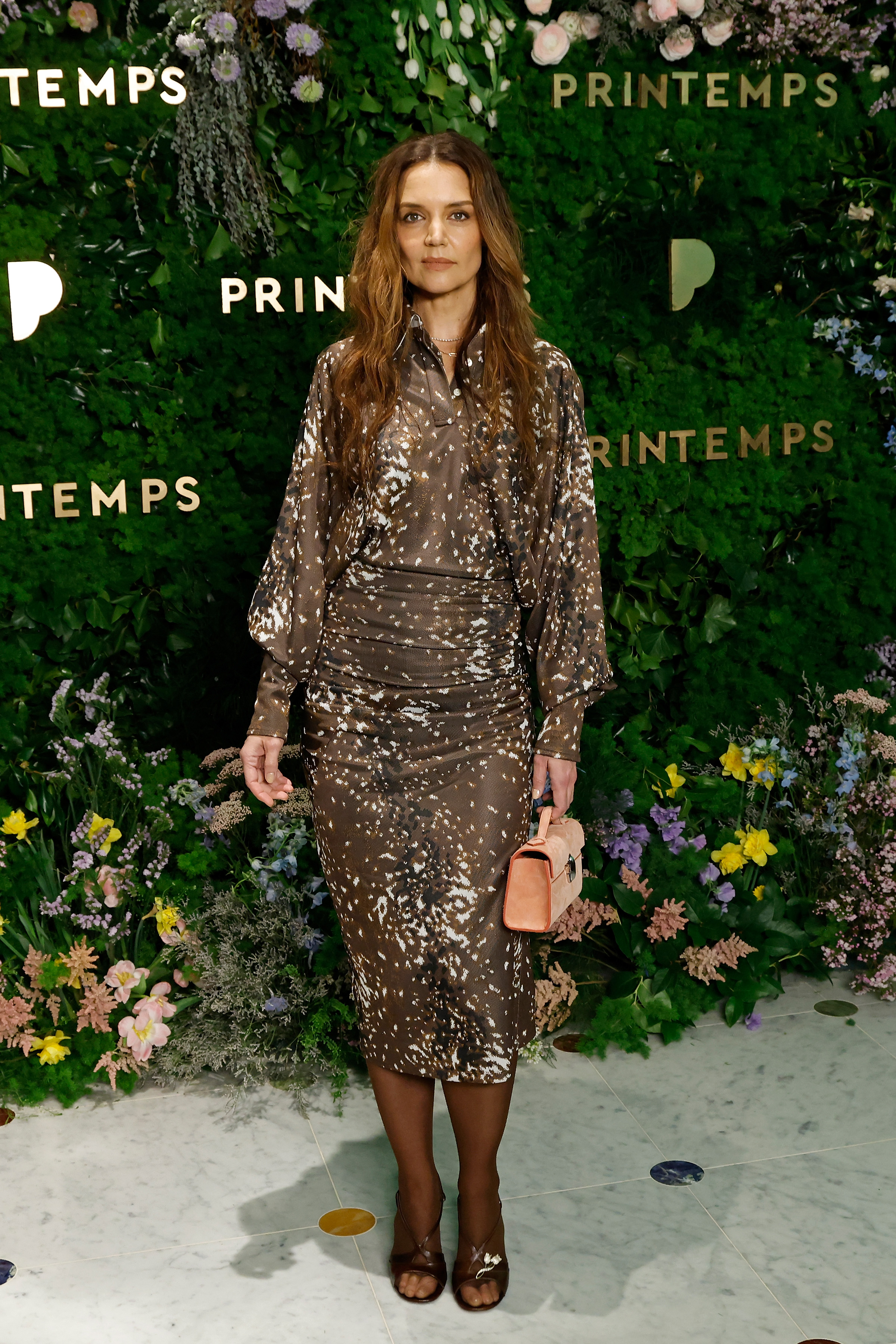 Katie Holmes posing for photos at the grand opening party. | Source: Getty Images