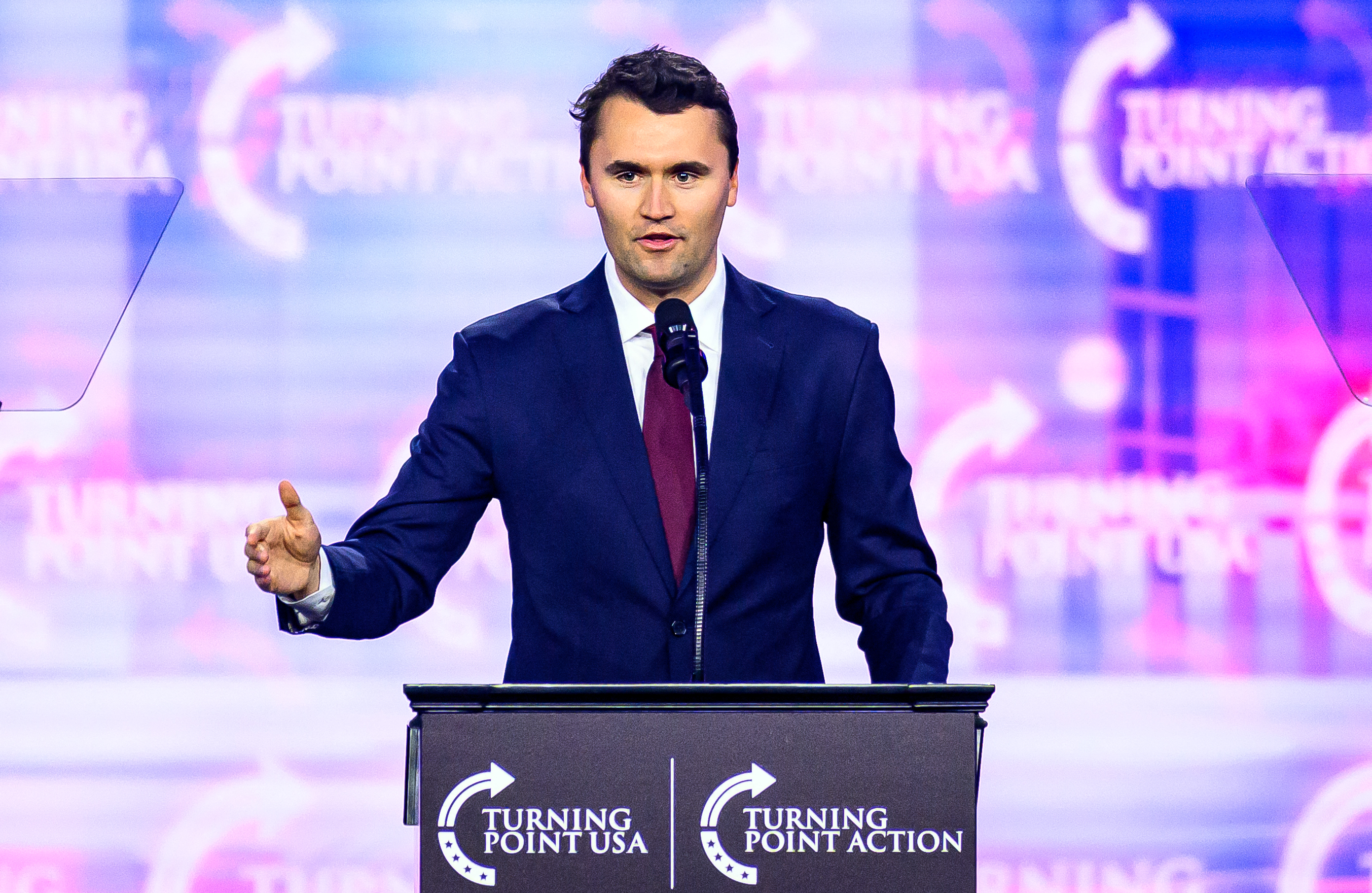 Charlie Kirk speaking on stage at America Fest 2024 in Phoenix, Arizona. | Source: Getty Images