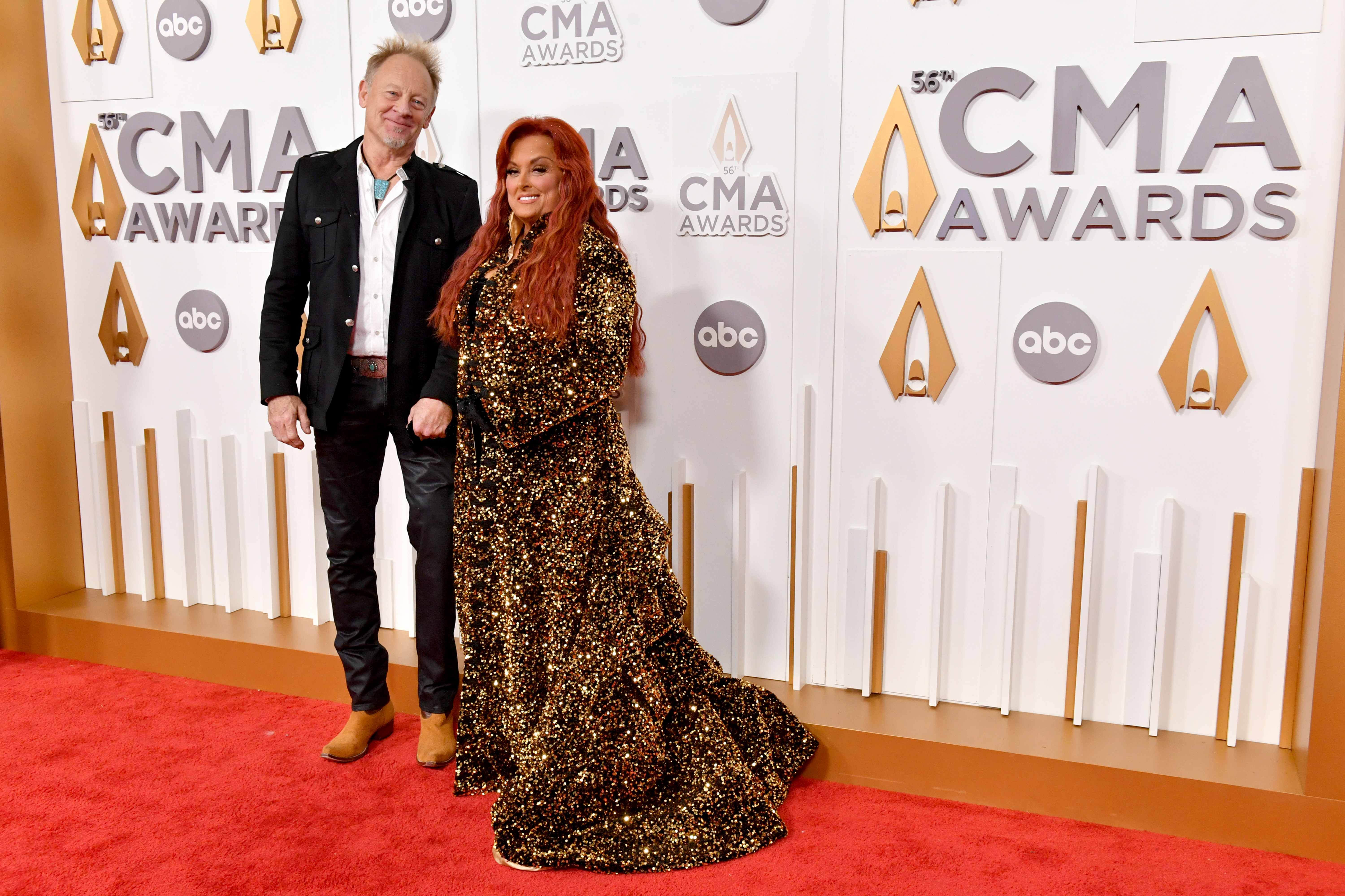 Wynonna attended the 56th Annual CMA Awards with her husband, Cactus Moser, in Nashville on November 9, 2022. The red-carpet appearance provides a full-length reference point from roughly two years before she publicly discussed hiring a trainer.