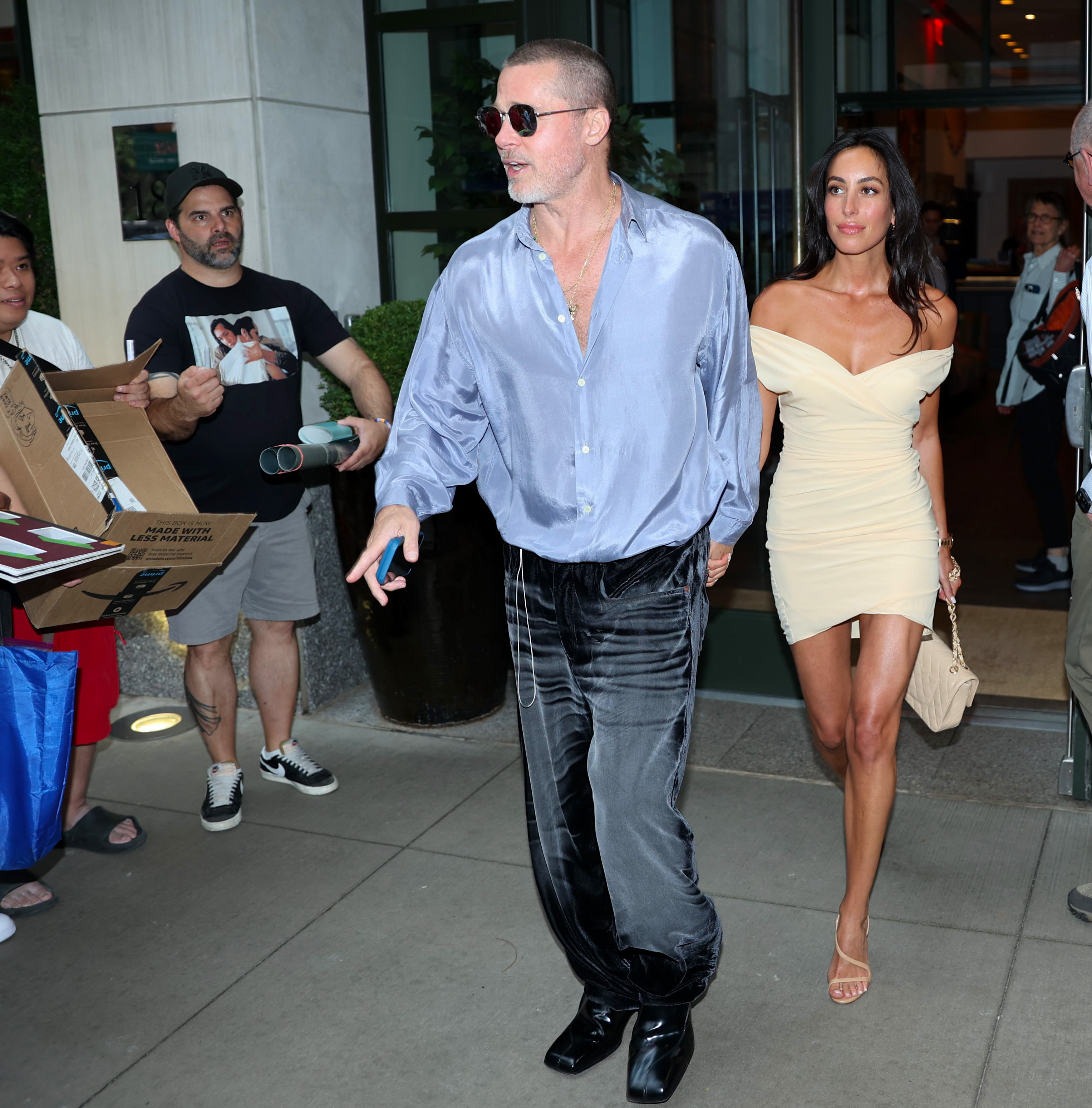 De Ramon wore a fitted cream off-the-shoulder mini dress during a New York outing with Pitt, who wore a blue shirt, dark trousers and sunglasses. The couple was photographed together during the outing.