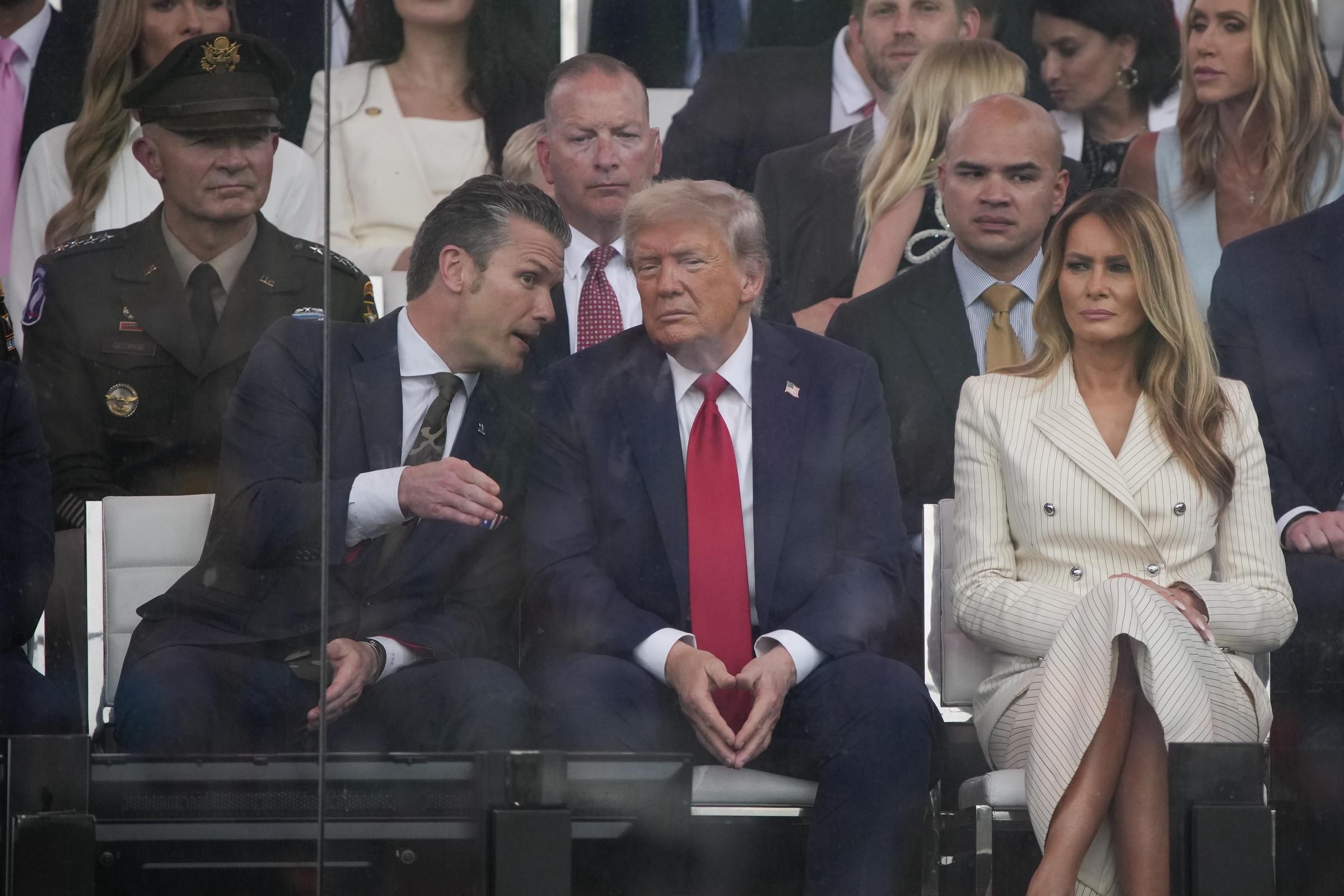 Donald Trump watches the military parade along with Secretary of Defense Pete Hegseth an Melania Trump in Washington, DC, on June 14, 2025 | Source: Getty Images