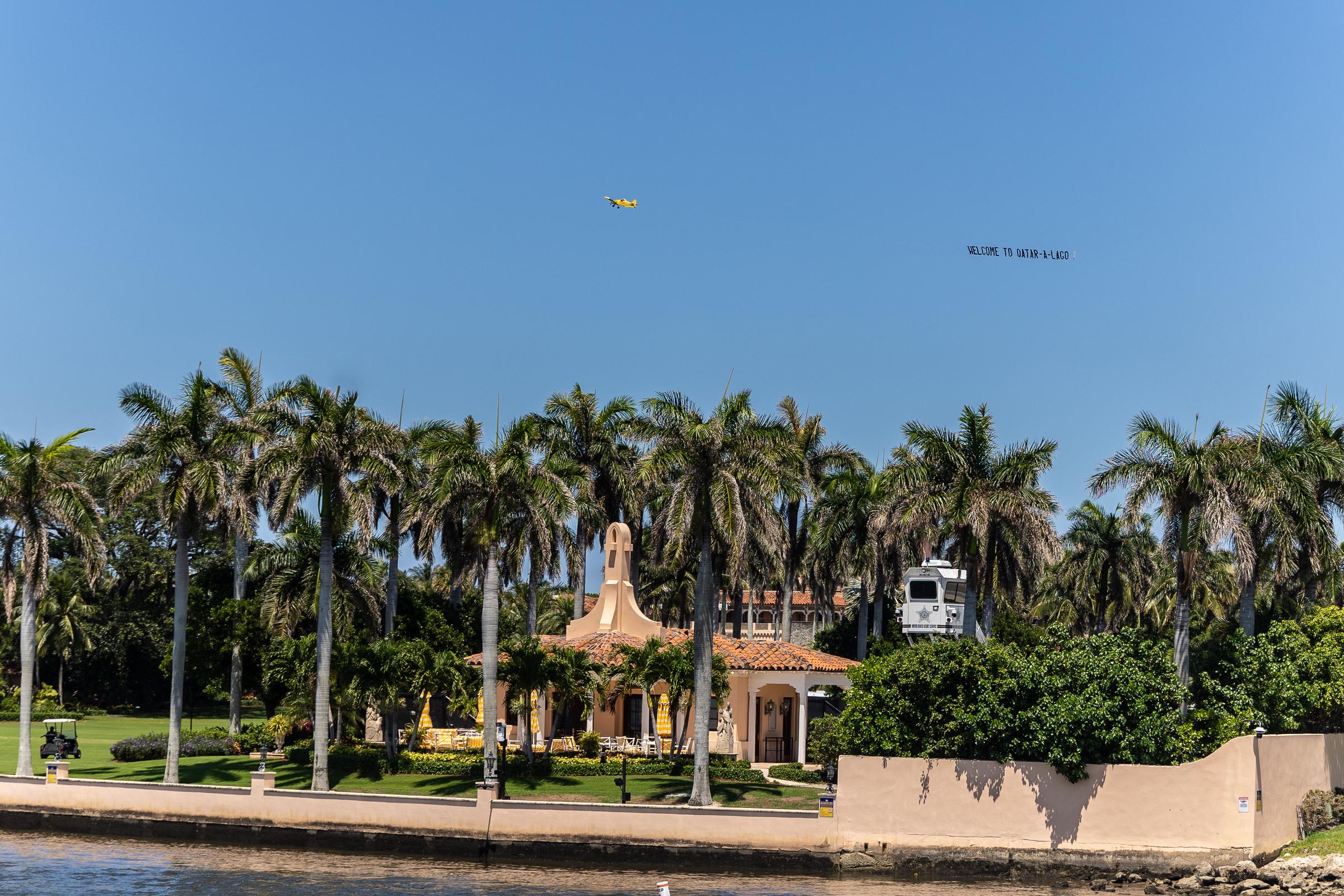 A plane flies a banner over Mar-A-Lago on May 14, 2025, in Palm Beach, Florida | Source: Getty Images