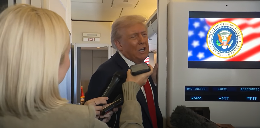 Donald Trump speaking to reporters aboard Air Force One | Source: YouTube/The White House