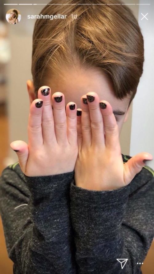 Rocky Prinze showed off his black glitter manicure in a photo shared on his mother's Instagram Stories, playfully covering his face with both hands. The sweet childhood moment offered a glimpse of his playful side. | Source: Instagram Stories/@sarahmgellar