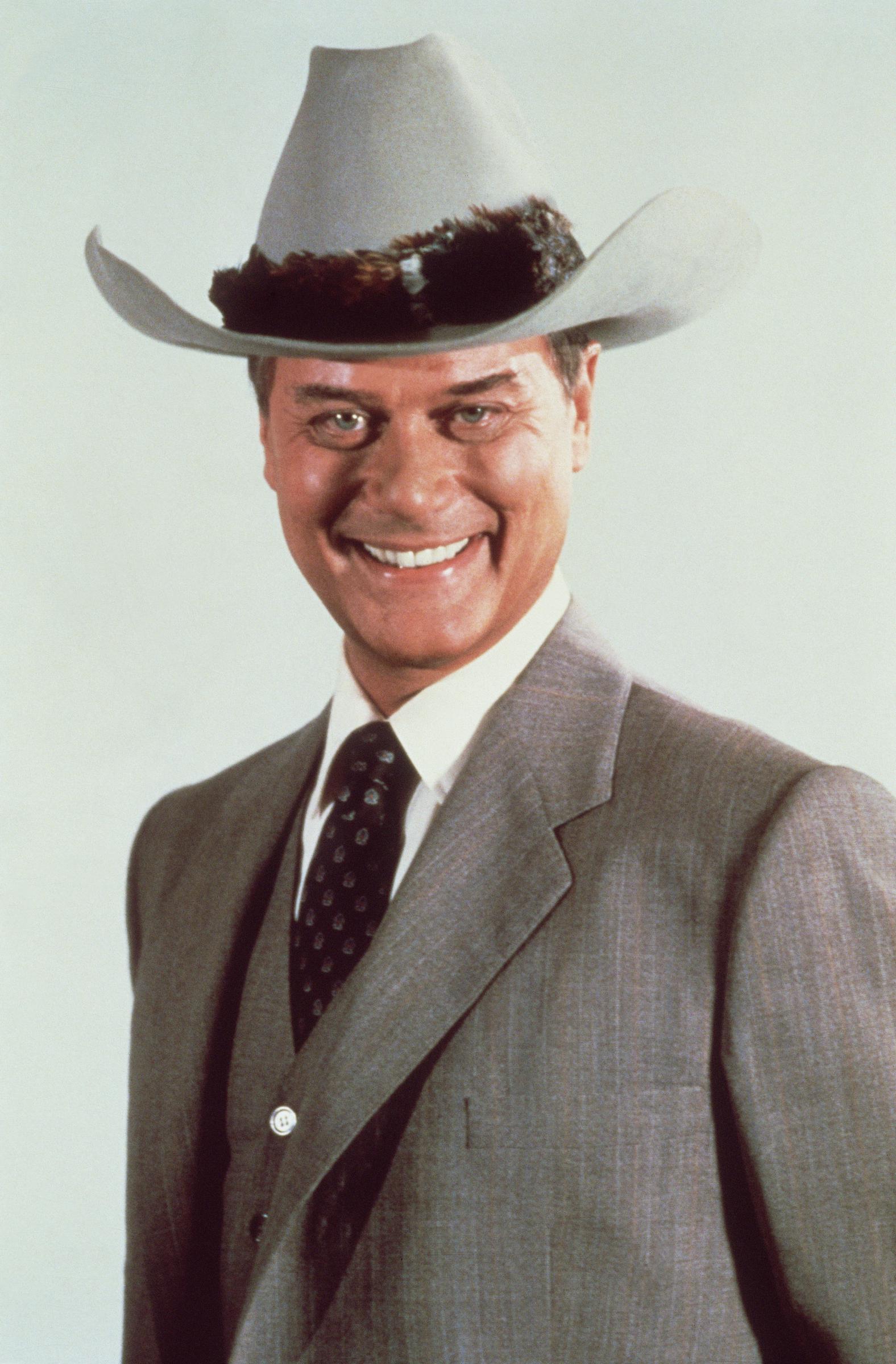 Larry Hagman smiles in a portrait, embodying the charismatic screen presence that made him a television icon. | Source: Getty Images
