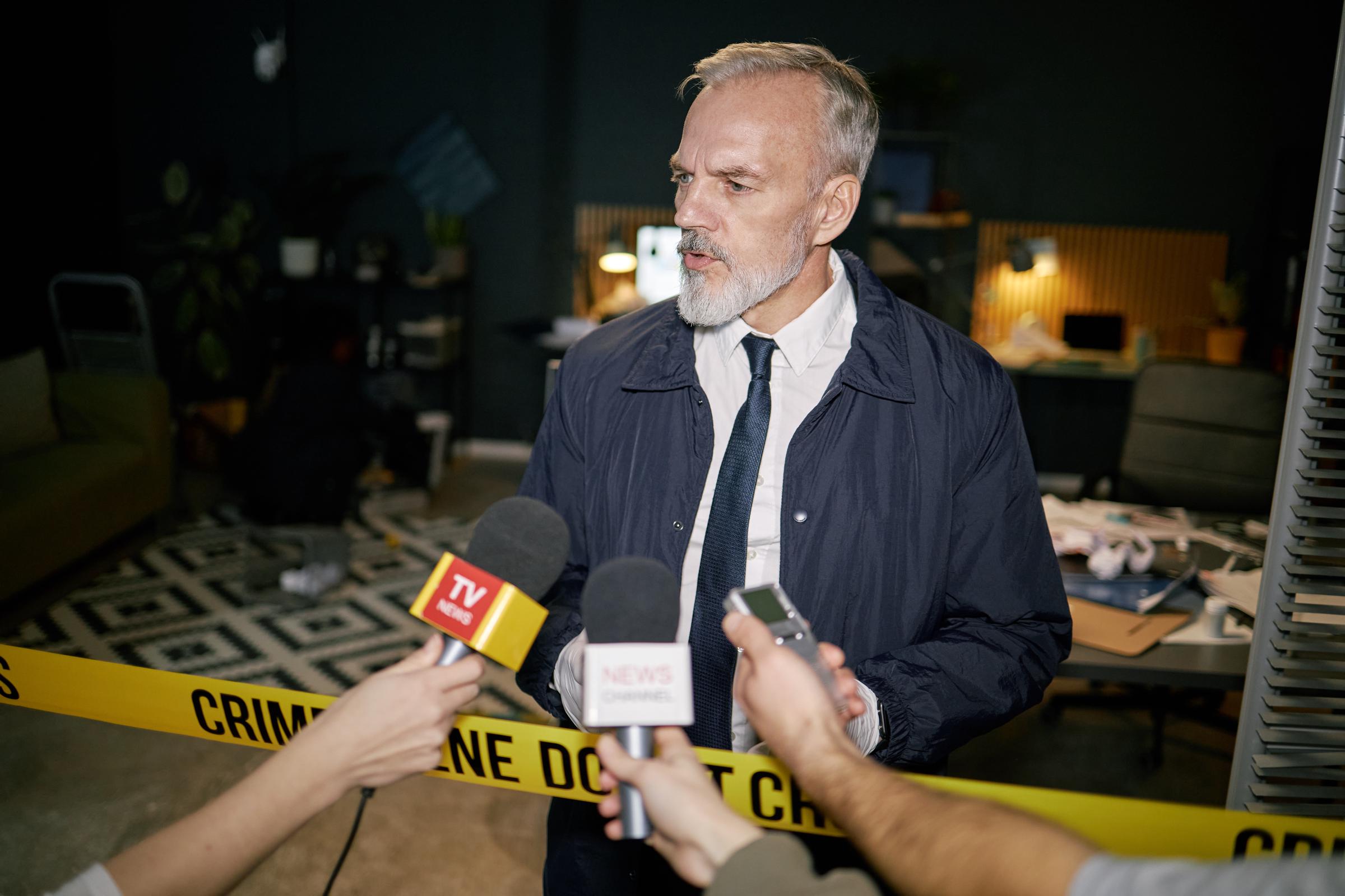 A photo of a man talking about a tragic incident to the news | Source: Getty Images