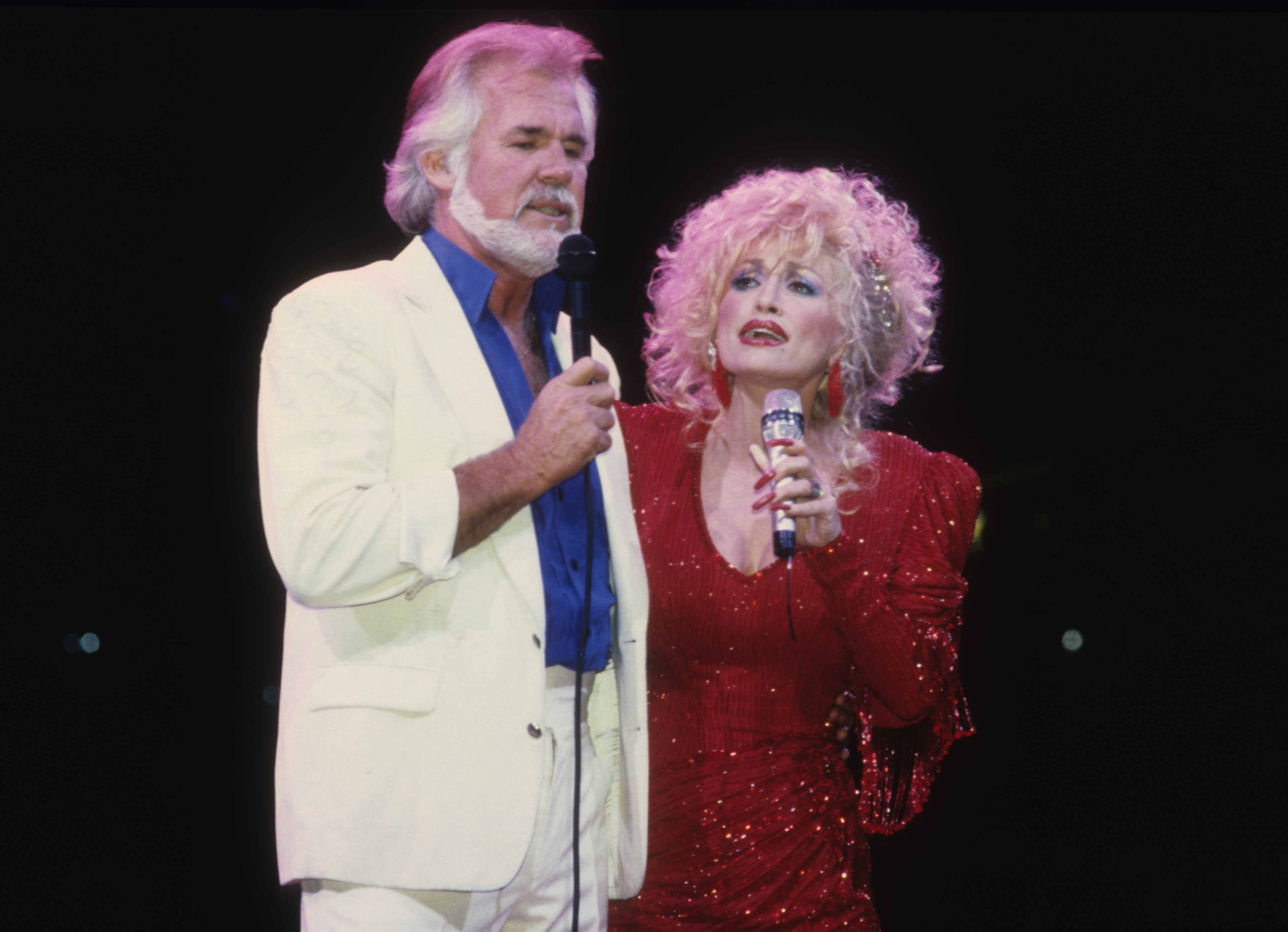 Dolly Parton and Kenny Rogers perform together onstage in 1990, reflecting the enduring friendship and musical partnership that kept them close for decades. | Source: Getty Images