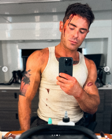 Hollywood star, Zac Efron in a white vest talking a selfie while on the set of his new movie posted on May 14, 2025 | Source: Instagram/zacefron