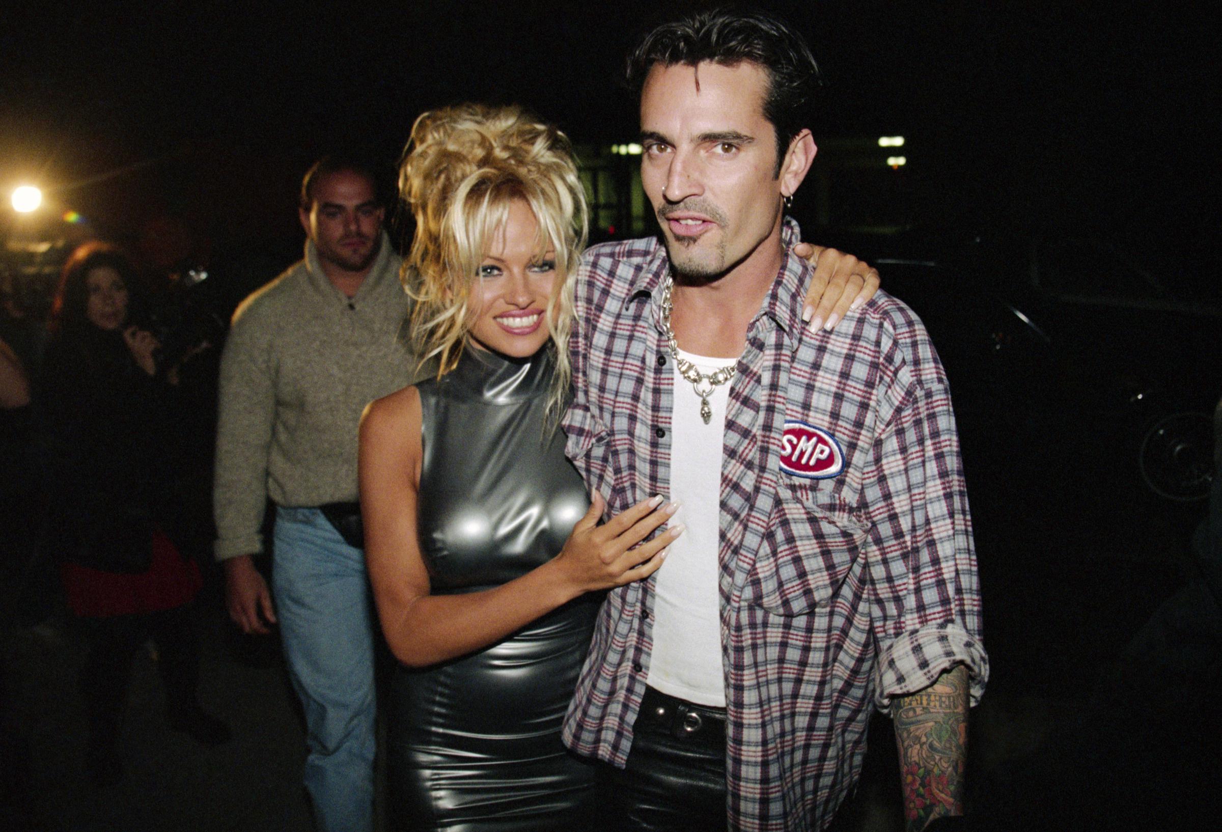 Pamela Anderson and Tommy Lee stepped out together during their whirlwind marriage, which began after a brief courtship and a beach wedding in Cancún in 1995. | Source: Getty Images