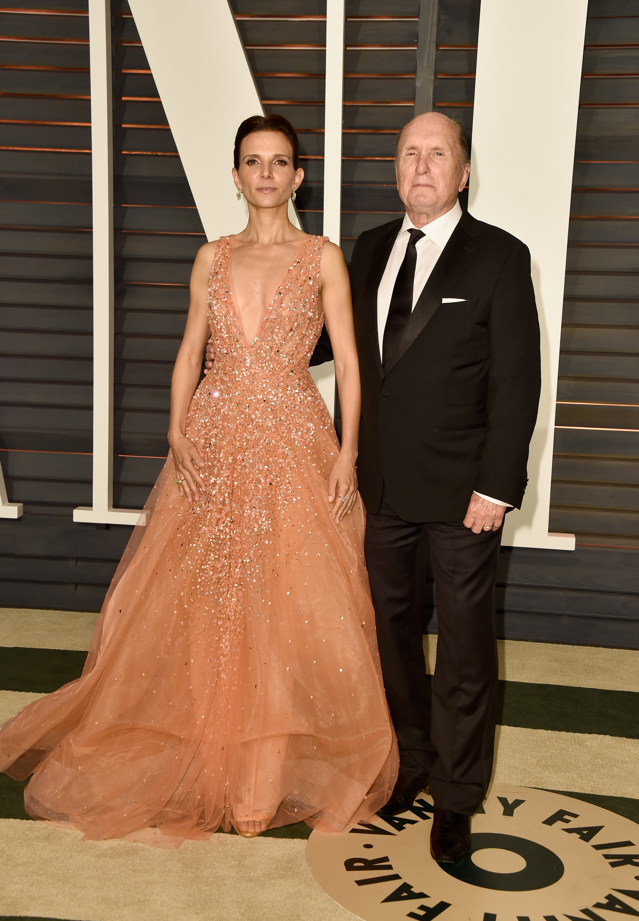 Luciana and Robert Duvall at the Vanity Fair Oscar Party in Beverly Hills, California on February 22, 2015. | Source: Getty Images