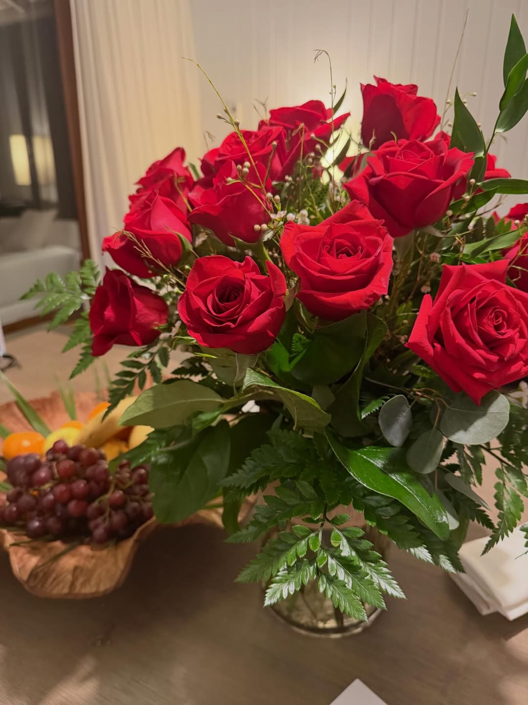 A bouquet of red roses sits beside a bowl of fresh fruit on a table inside Richard Gere and Alejandra Silva's Spain home, offering a glimpse of the family's interior décor. | Source: Instagram/alejandragere