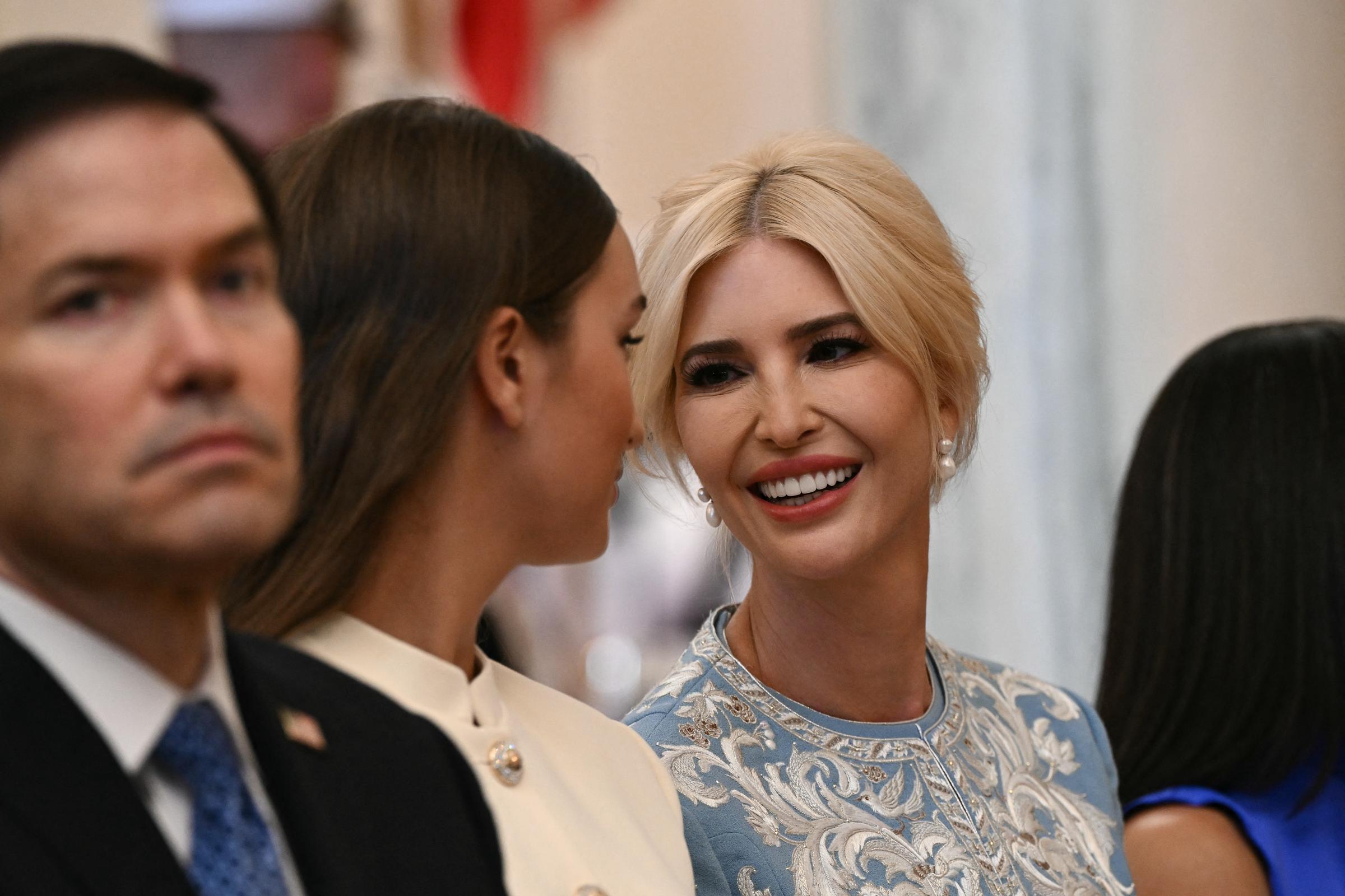 Ivanka Trump shared a cheerful, candid exchange with her daughter Arabella Kushner during the official White House arrival ceremony for Chinese President Xi Jinping and Peng Liyuan on September 24, 2026, in Washington, DC. Wearing an elegantly embroidered powder-blue ensemble, drop pearl earrings, and an updo, Ivanka smiled brightly toward Arabella—who donned a chic cream high-collared piece—while standing alongside U.S. Secretary of State Marco Rubio among distinguished guests. | Source: Getty Images