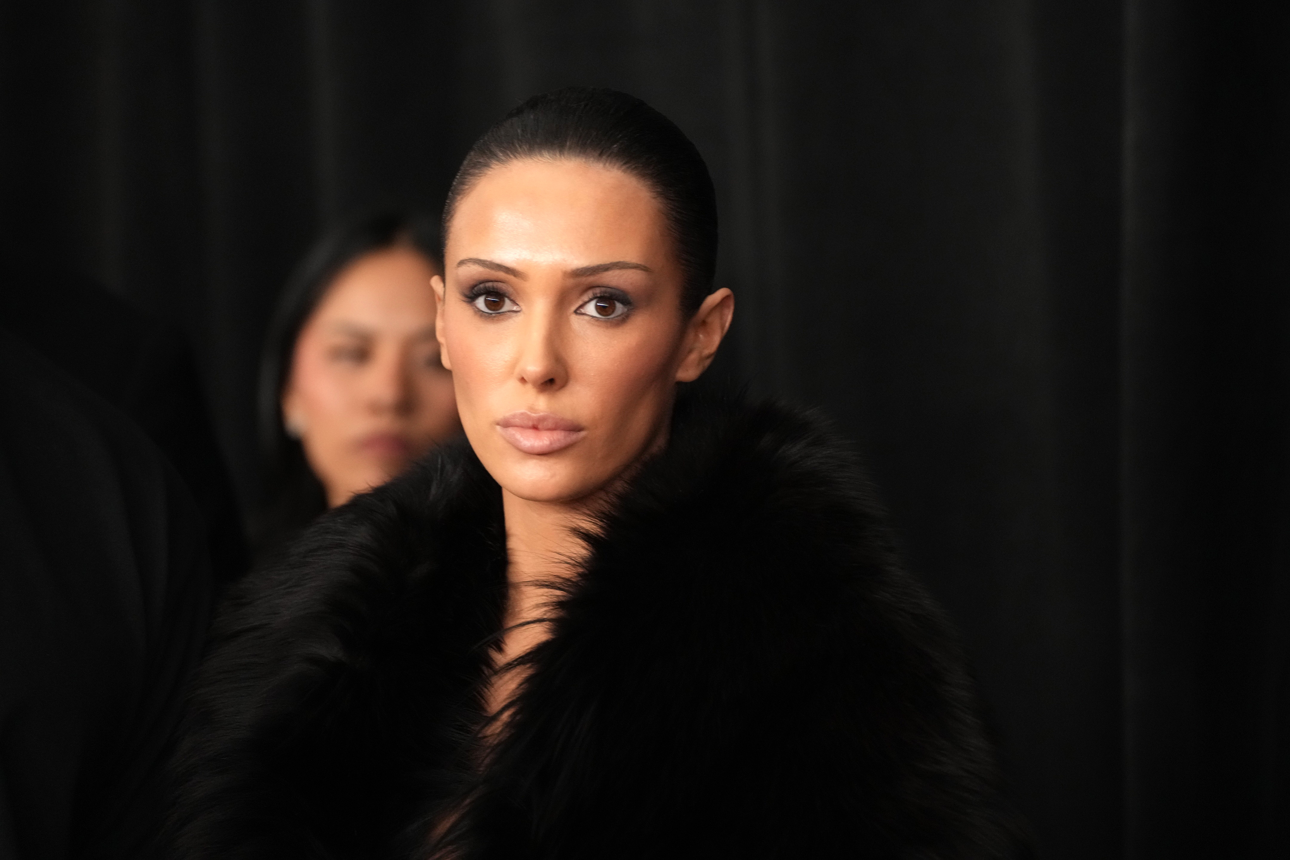 Bianca Censori poses in a dark fur-look outfit while attending the 67th Grammy Awards in Los Angeles on February 2, 2025 | Source: Getty Images