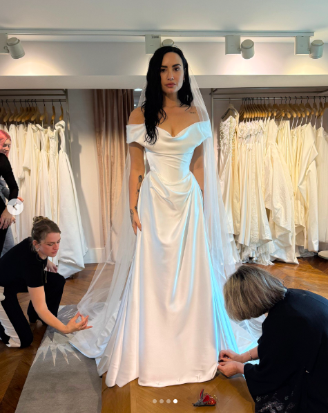 Demi Lovato posing for a picture in her wedding dress, posted on May 26, 2025. | Source: Instagram/voguemagazine