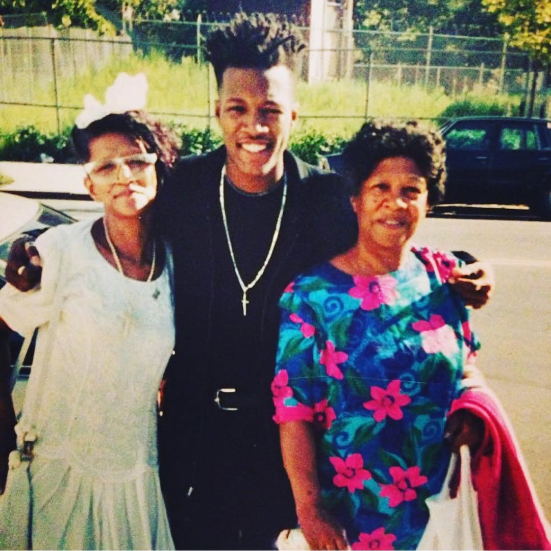 Flex Alexander posing outside with two loved ones, posted on May 9, 2021. | Source: Instagram/flexaforeal