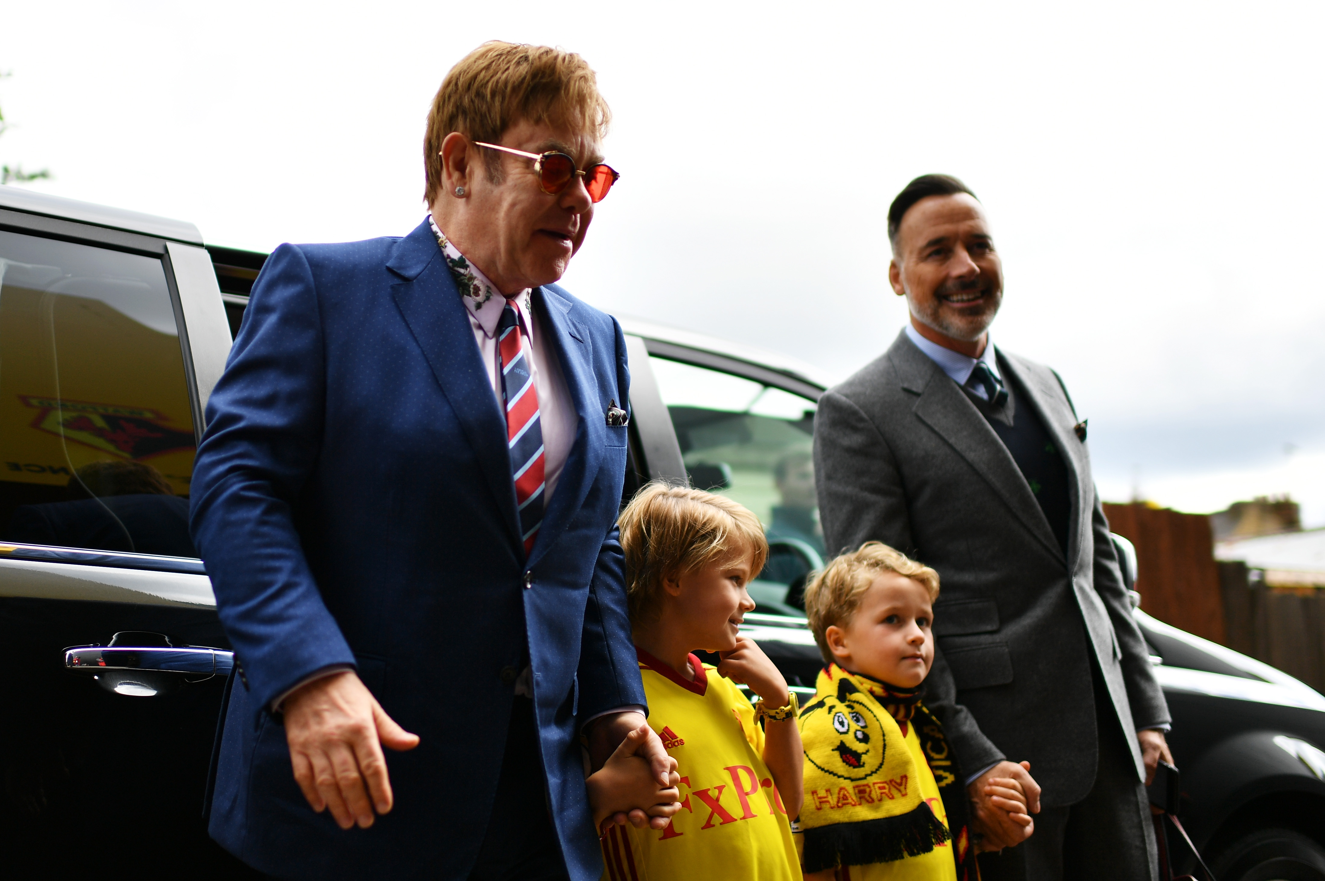 Elton John and David Furnish with their sons, Elijah and Zachary Furnish-John, ahead of the Premier League match between Watford and Manchester City on September 16, 2017, in England. | Source: Getty Images
