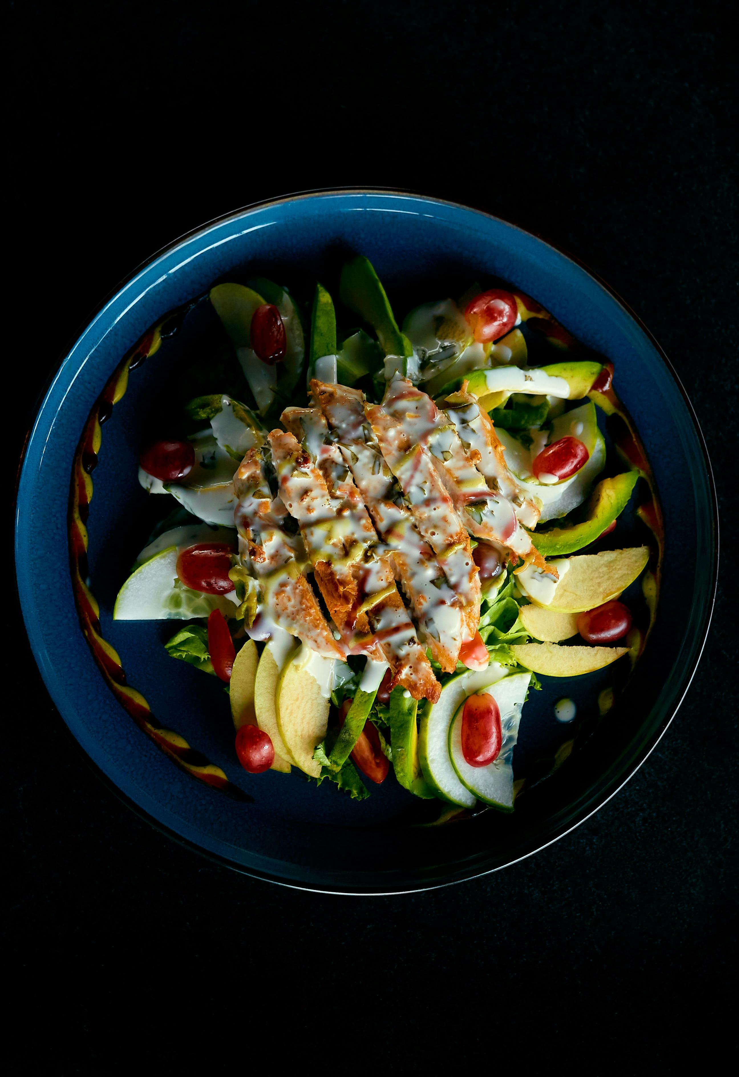 Chicken salad on ceramic plate | Source: Pexels
