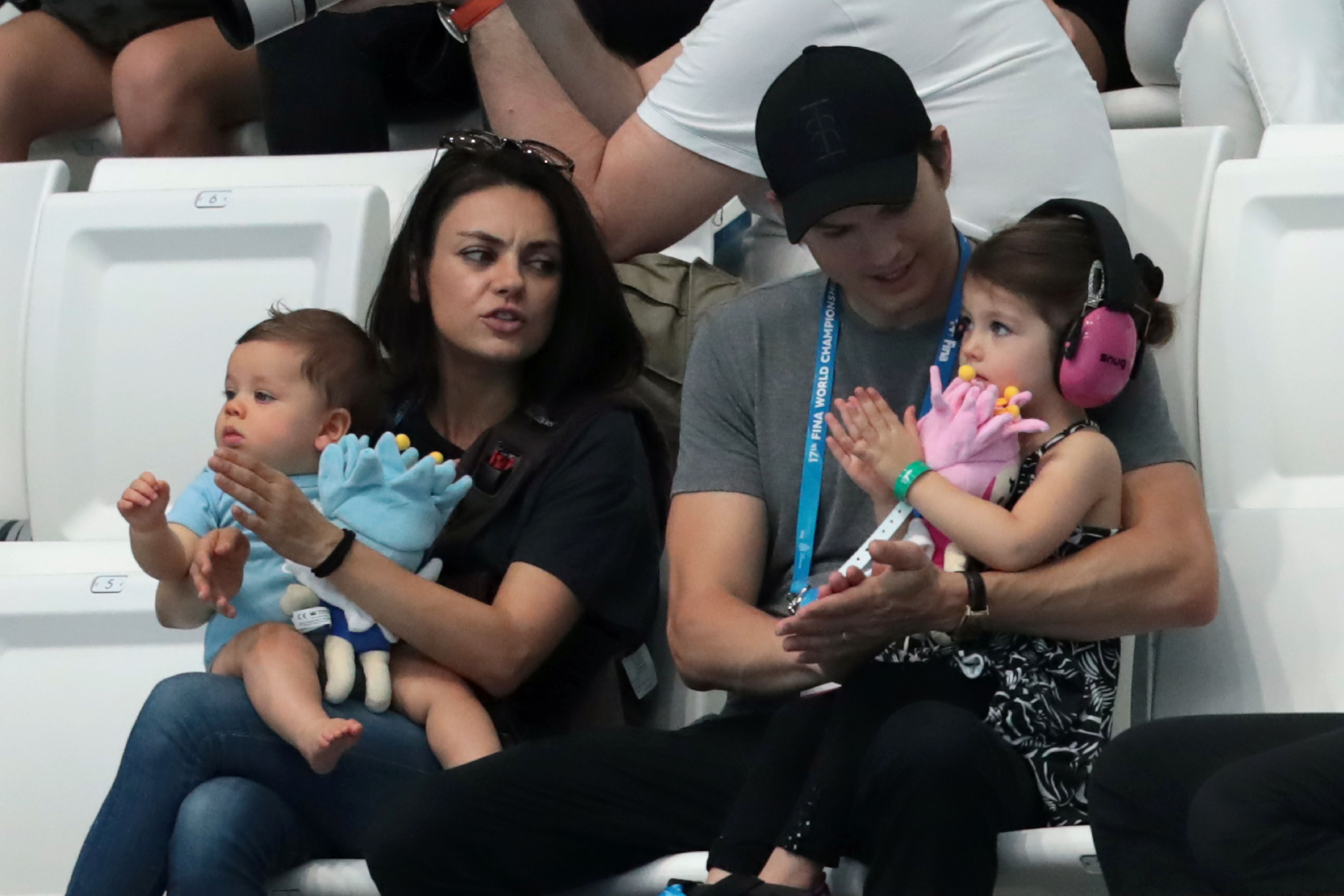 Mila Kunis and Ashton Kutcher with their children during the diving competition at the 2017 World Aquatics Championships in Budapest, Hungary, on July 17. | Source: Getty Images
