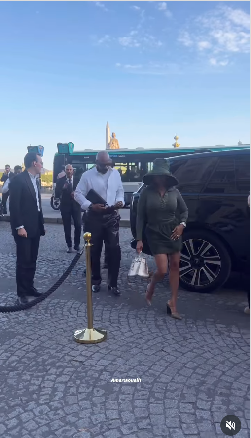 Majorie Harvey walks slightly ahead of her husband, Steve as they are sighted in Paris, from a video post dated June 20, 2025 | Source: Instagram/taoualit_amar