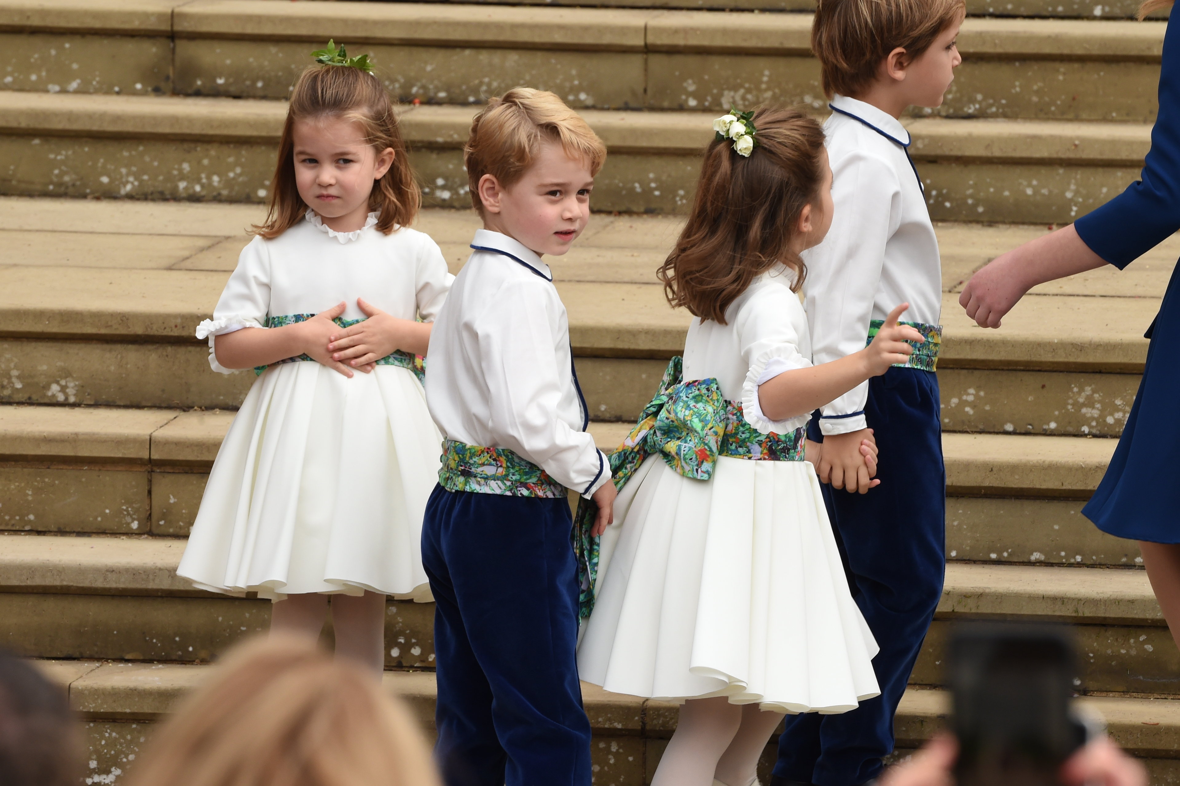George joined Princess Charlotte and other young attendants for Princess Eugenie and Jack Brooksbank’s wedding at St. George’s Chapel on Oct. 12. At 5, his role as a page boy placed him in another major royal occasion as his childhood unfolded in public.