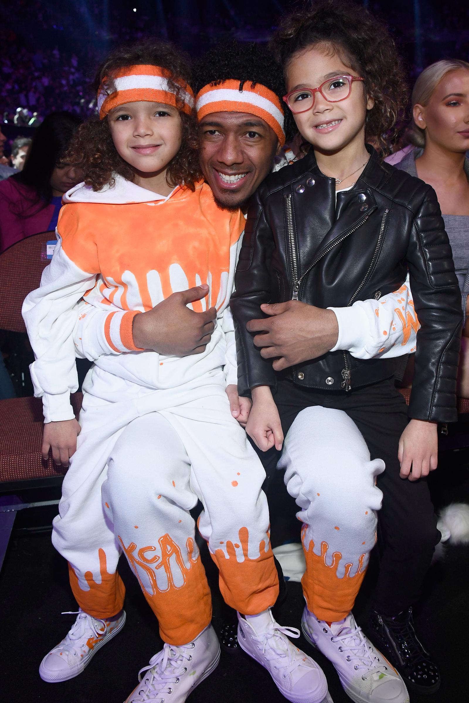 Moroccan Scott Cannon and Monroe Cannon, aged 6, attend Nickelodeon's Kids' Choice Awards with their father, Nick Cannon, at The Forum on March 24, 2018, in Inglewood, California.