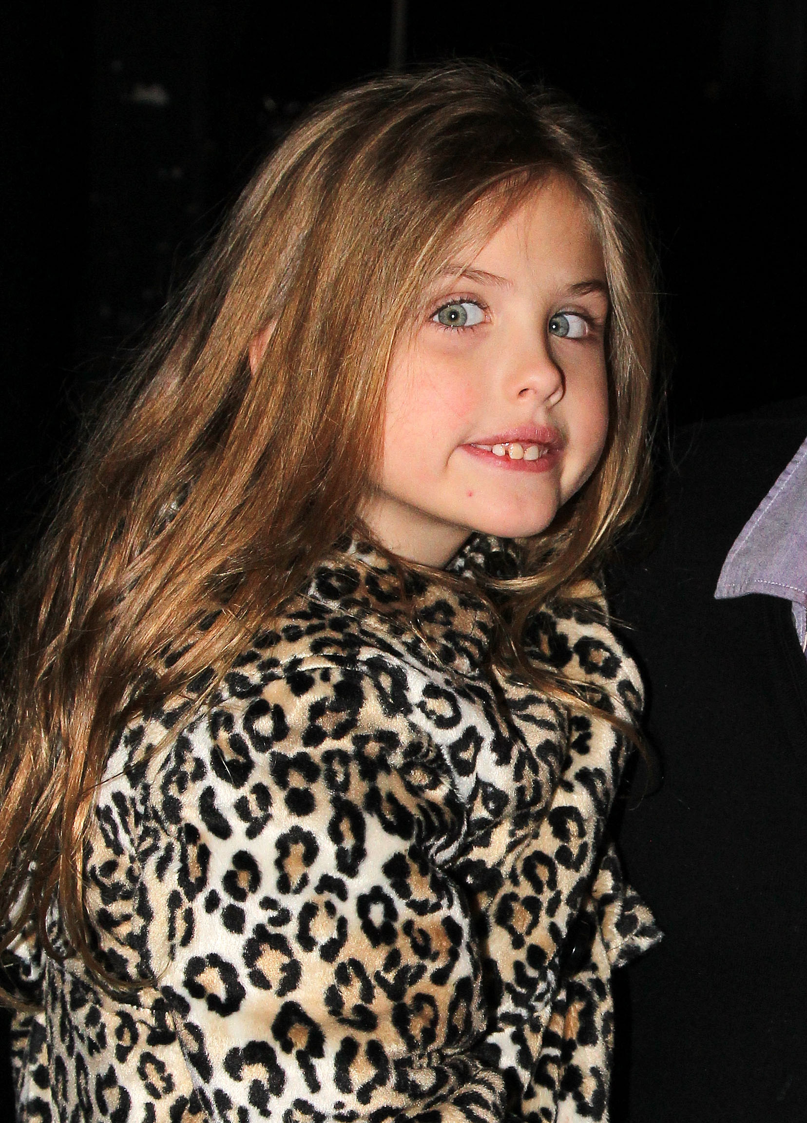 Framed by a cascade of honey-brown hair and wide, sparkling eyes, 6-year-old Dannielynn Birkhead beamed backstage at Broadway's hit musical "Annie" on January 20, 2013. A playful leopard-print coat added a chic, energetic touch to her look, while her bright, cheerful smile highlighted a blossoming confidence and a vibrant, independent spirit.