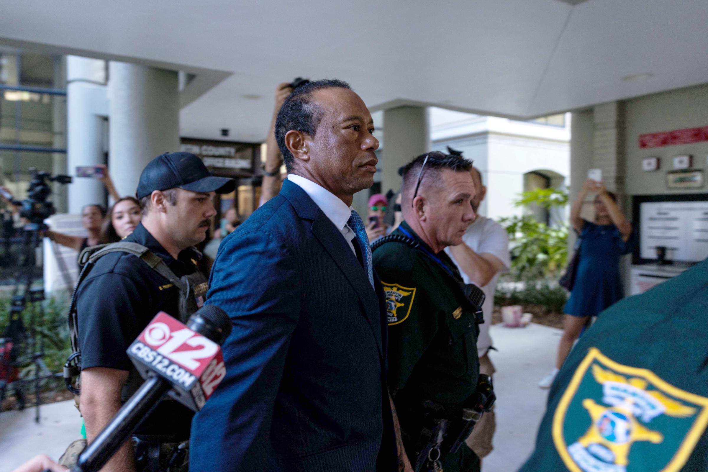 The intense media presence surrounding Tiger Woods' courthouse entry underscored just how closely every movement was being watched, with photographers and reporters crowding around him as he made his way outside. | Source: Getty Images