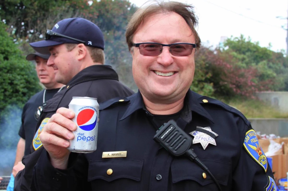 Kevin Mannix smiles at an informal gathering in his San Francisco Police Department sergeant's uniform. Former colleagues remembered him as friendly and easygoing, with no behavior during their professional interactions that suggested the violence later attributed to him. | Source: San Francisco Chronicle