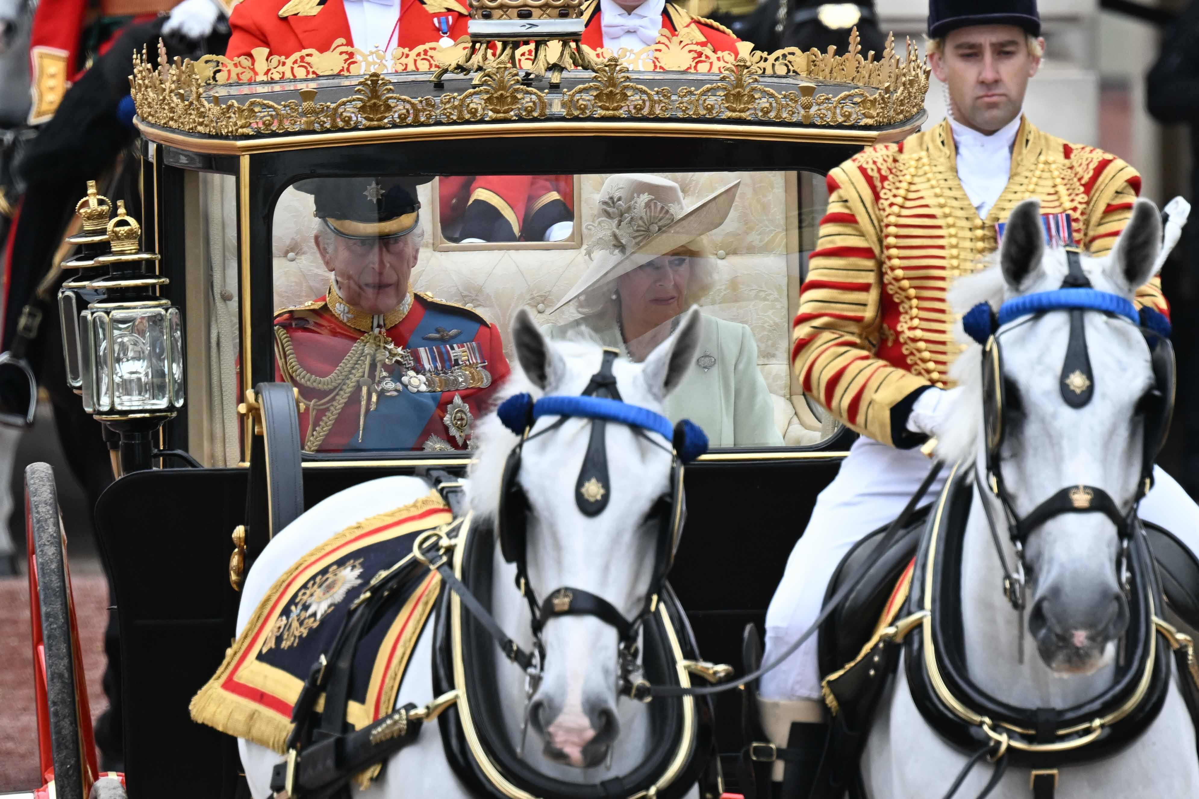 Led by a ceremonial escort, the Scottish State Coach carries King Charles III and Queen Camilla through London as part of the King's Birthday Parade on June 15, 2024 | Source: Getty Images