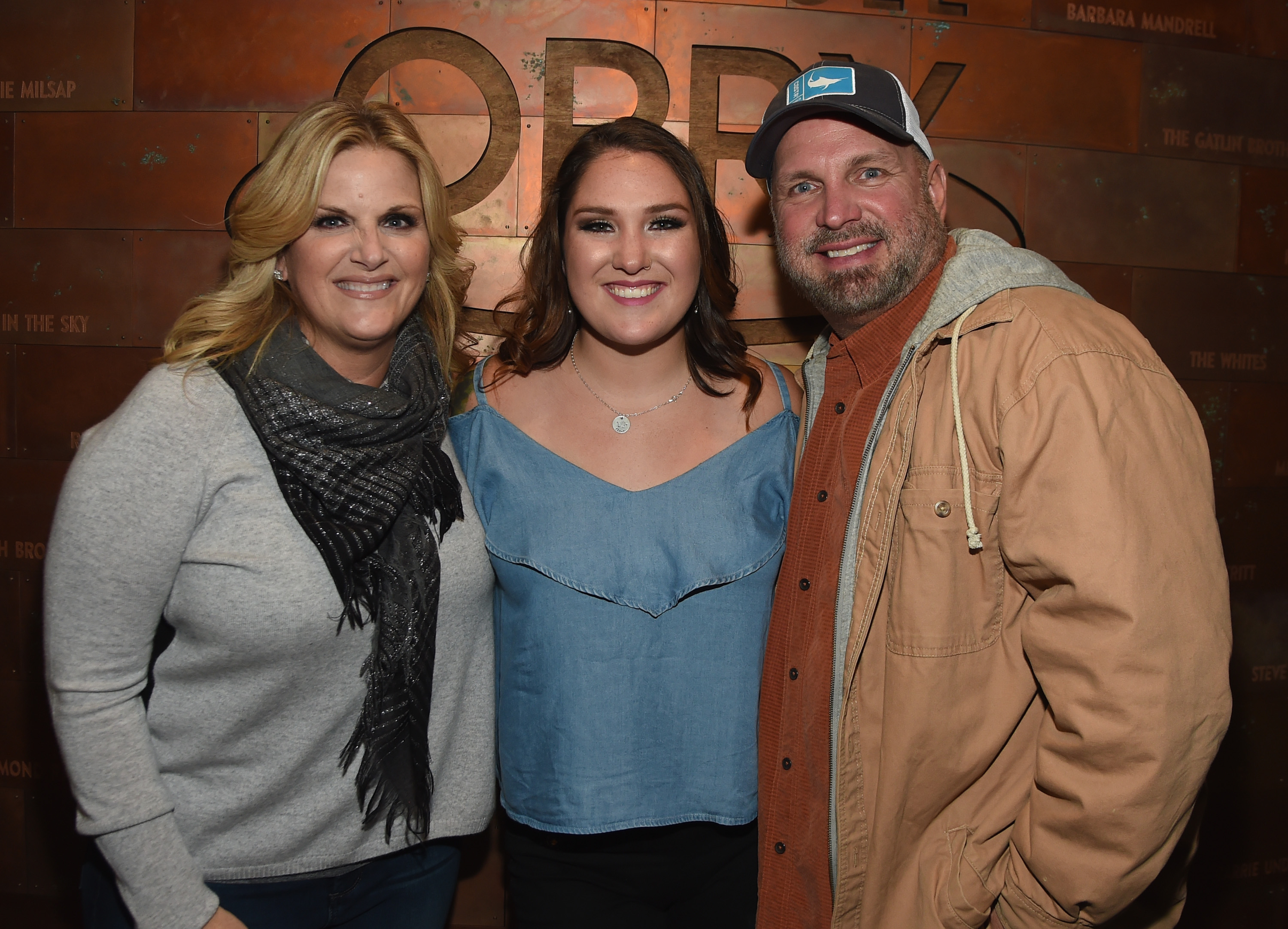 Allie Colleen Brooks with her parents, singers Trisha Yearwood, and Garth Brooks after Allie's Grand Ole Opry debut on October 19, 2017, in Nashville, Tennessee. | Source: Getty Images