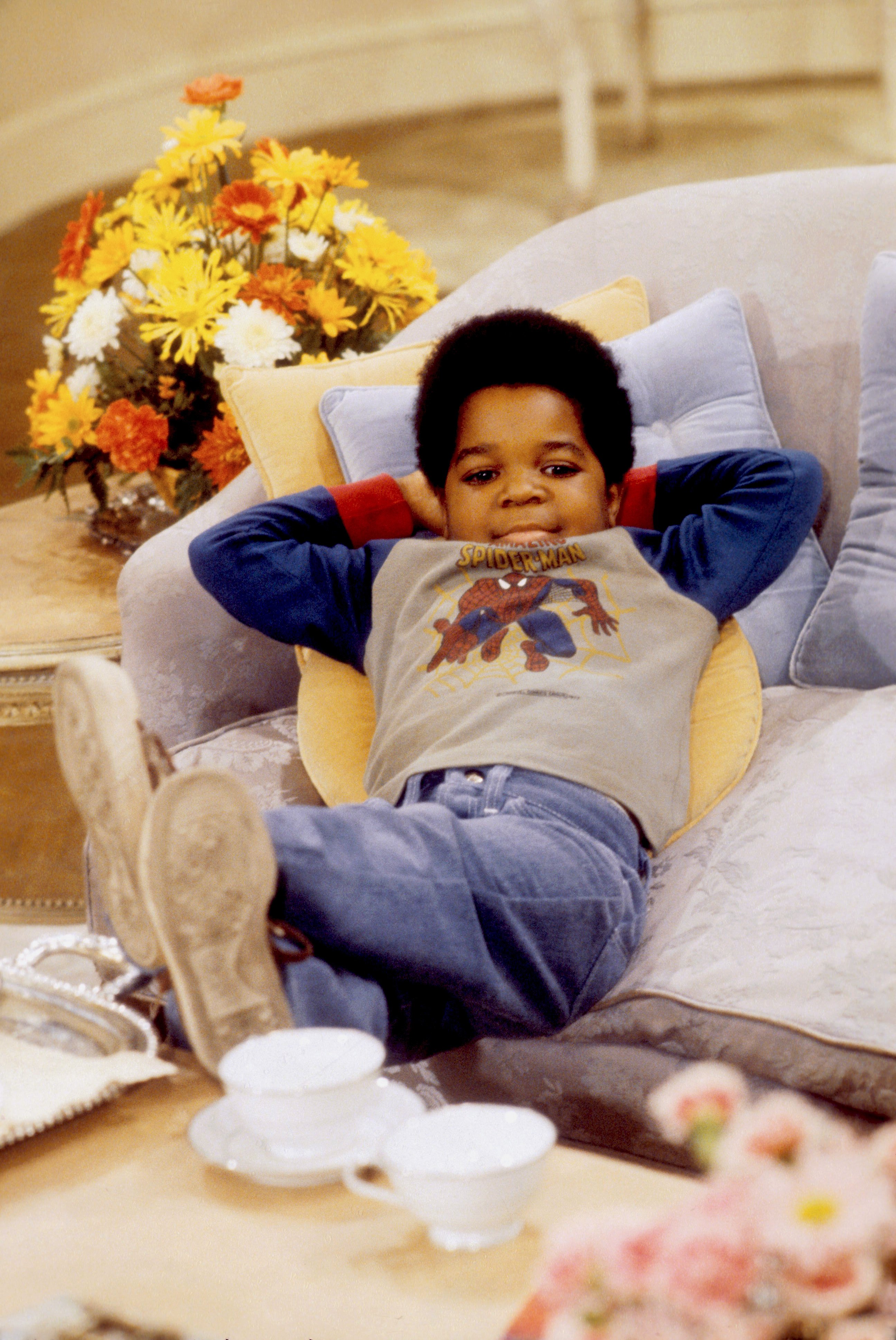 Gary Coleman relaxes on the set of Diff'rent Strokes circa 1980 in Los Angeles, California. Coleman became one of television's biggest child stars as Arnold Jackson, with his kidney condition and multiple transplants affecting his growth. | Source: Getty Images
