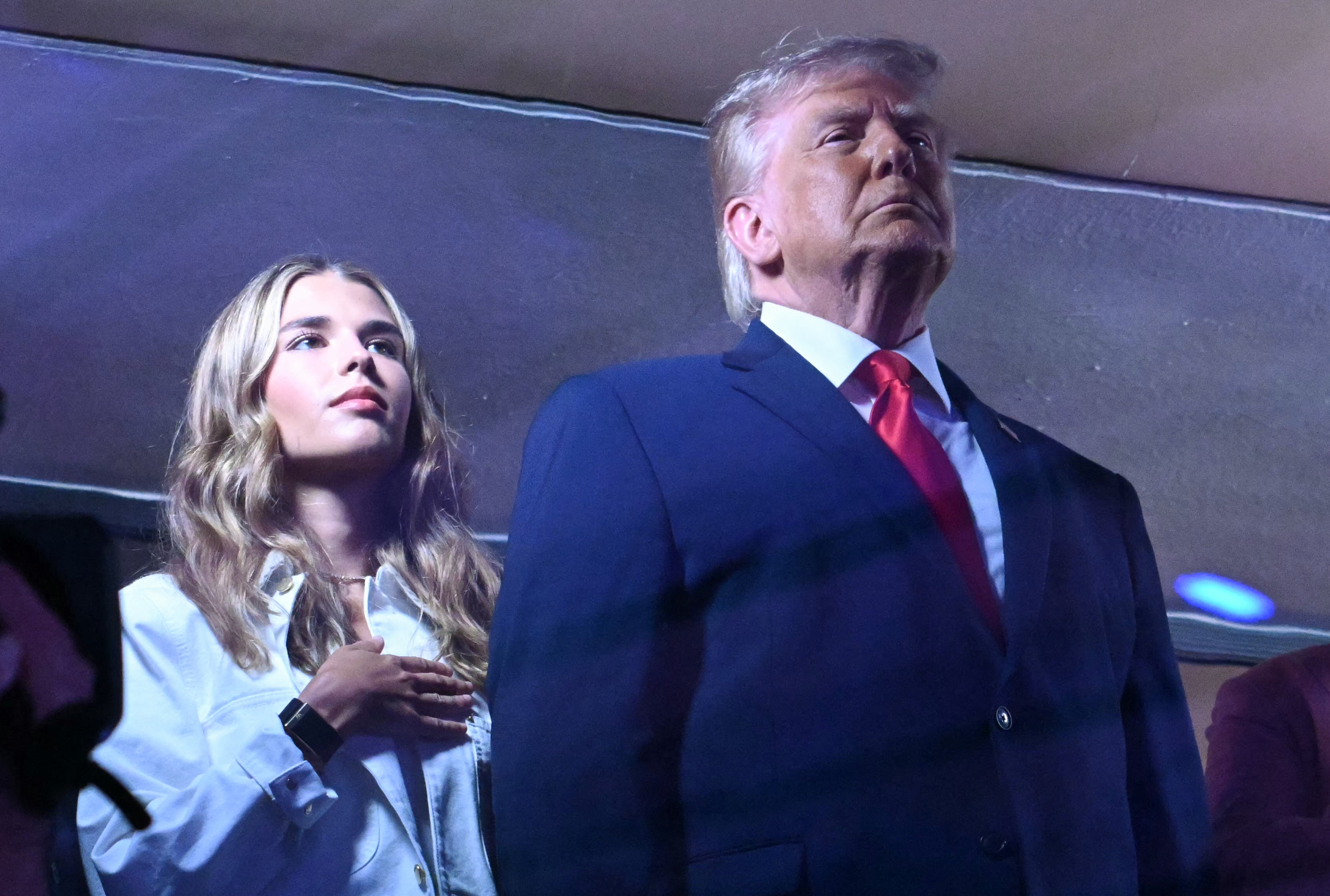 Donald Trump stands alongside granddaughter Kai Trump during the national anthem before Game 3 of the NBA Finals at Madison Square Garden. The president's appearance drew widespread attention as he became the first sitting U.S. president to attend an NBA Finals game. | Source: Getty Images