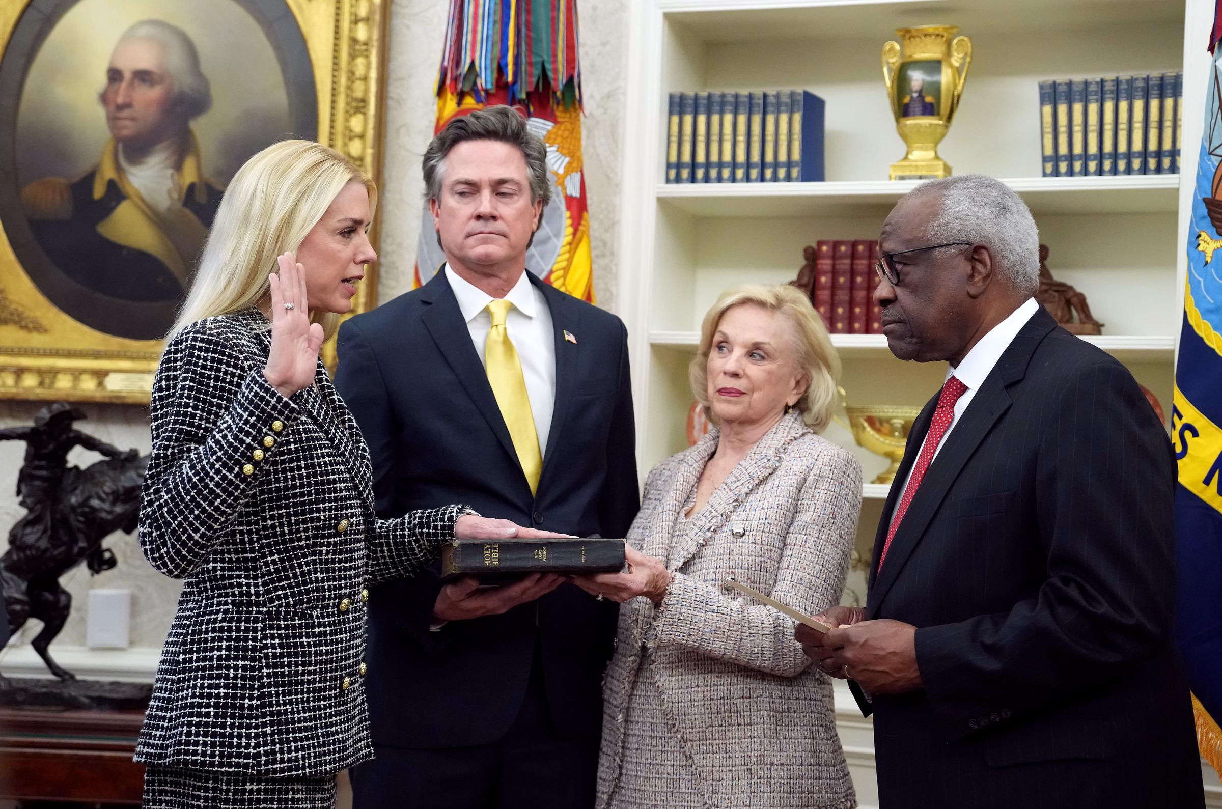 Pam Bondi is sworn in as U.S. Attorney General by U.S. Supreme Court Justice Clarence Thomas while John Wakefield and Patsy Bondi look on in the Oval Office on February 5, 2025 | Source: Getty Images