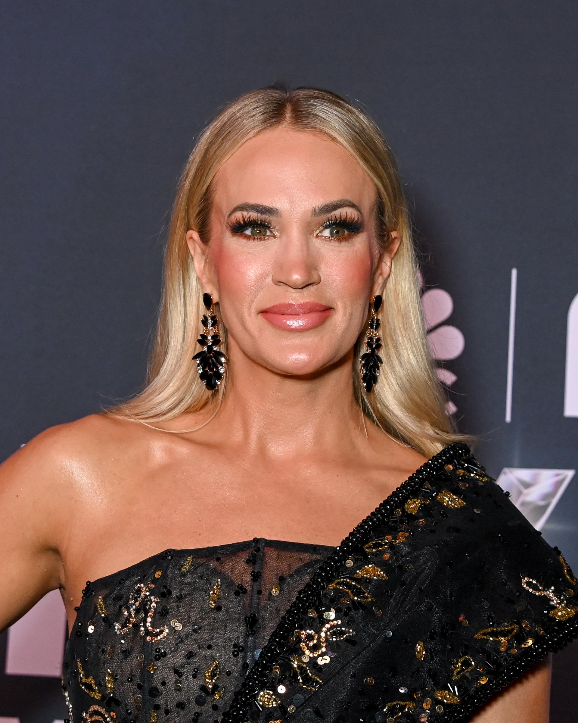 Carrie Underwood attended NBC's "Opry 100: A Live Celebration" at the Grand Ole Opry House in Nashville in March 2025. The red carpet appearance showcased her signature blonde hair and glamorous styling during another busy year in the spotlight. | Source: Getty Images