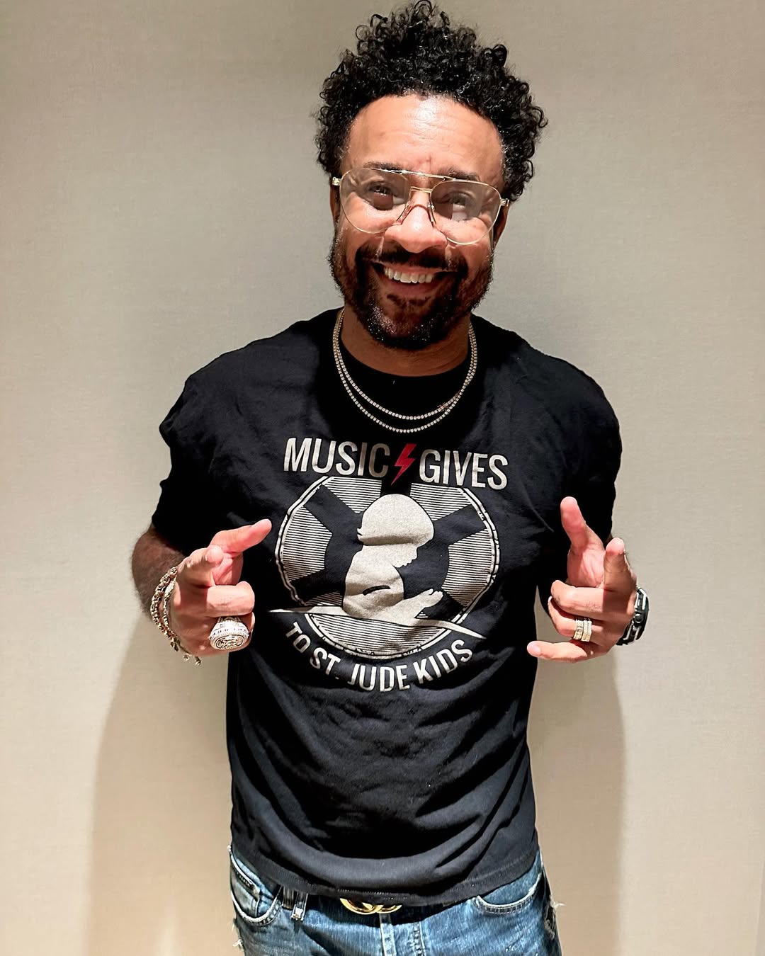 Shaggy smiles and points toward the camera while posing indoors | Source: Instagram/direalshaggy