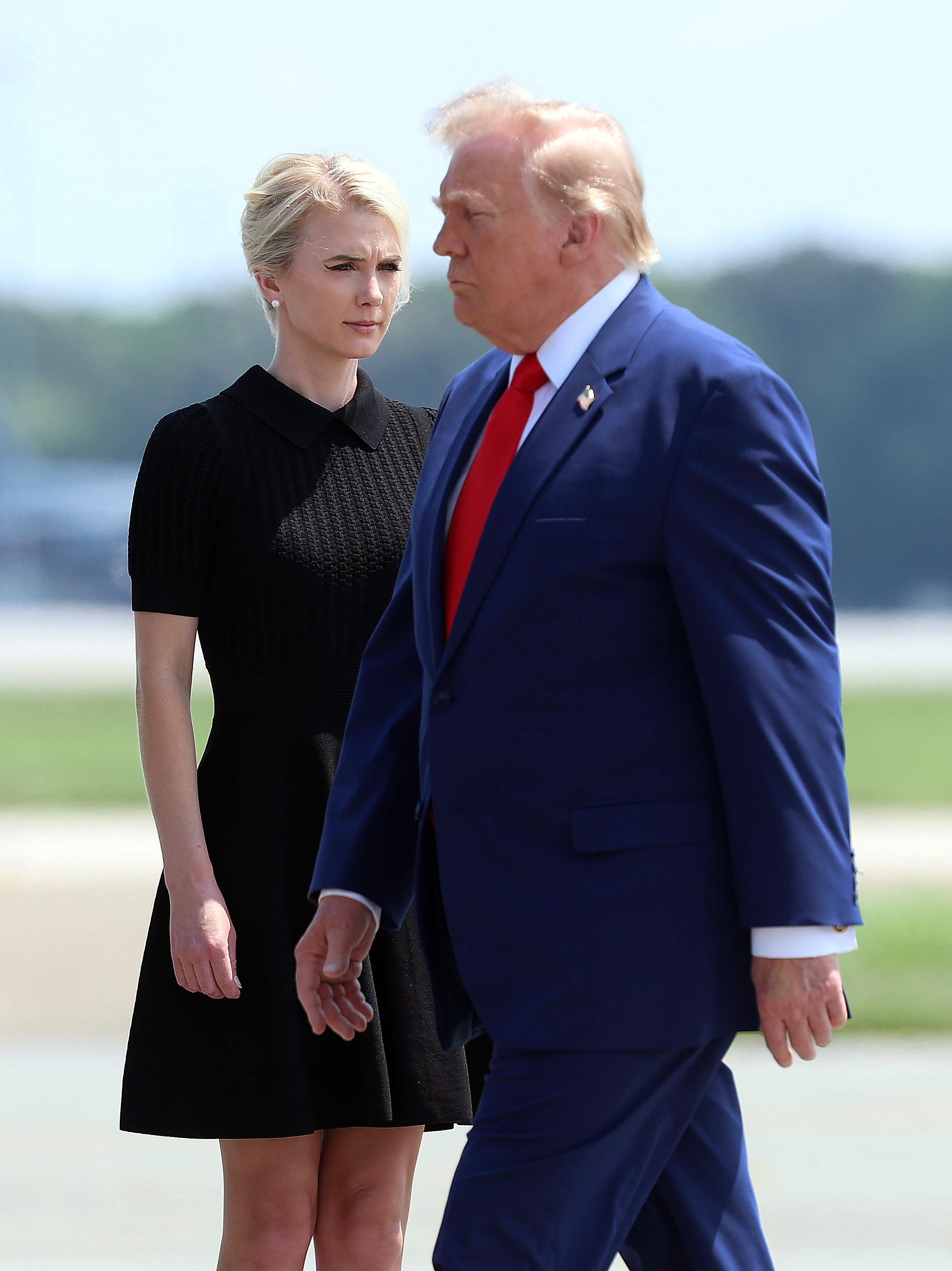 Donald Trump and aide Natalie Harp are pictured together as her unusually close access to the president drew increasing attention. The reported motorcade incident would later become one of the most striking examples of how far she allegedly went to stay by his side. | Source: Getty Images