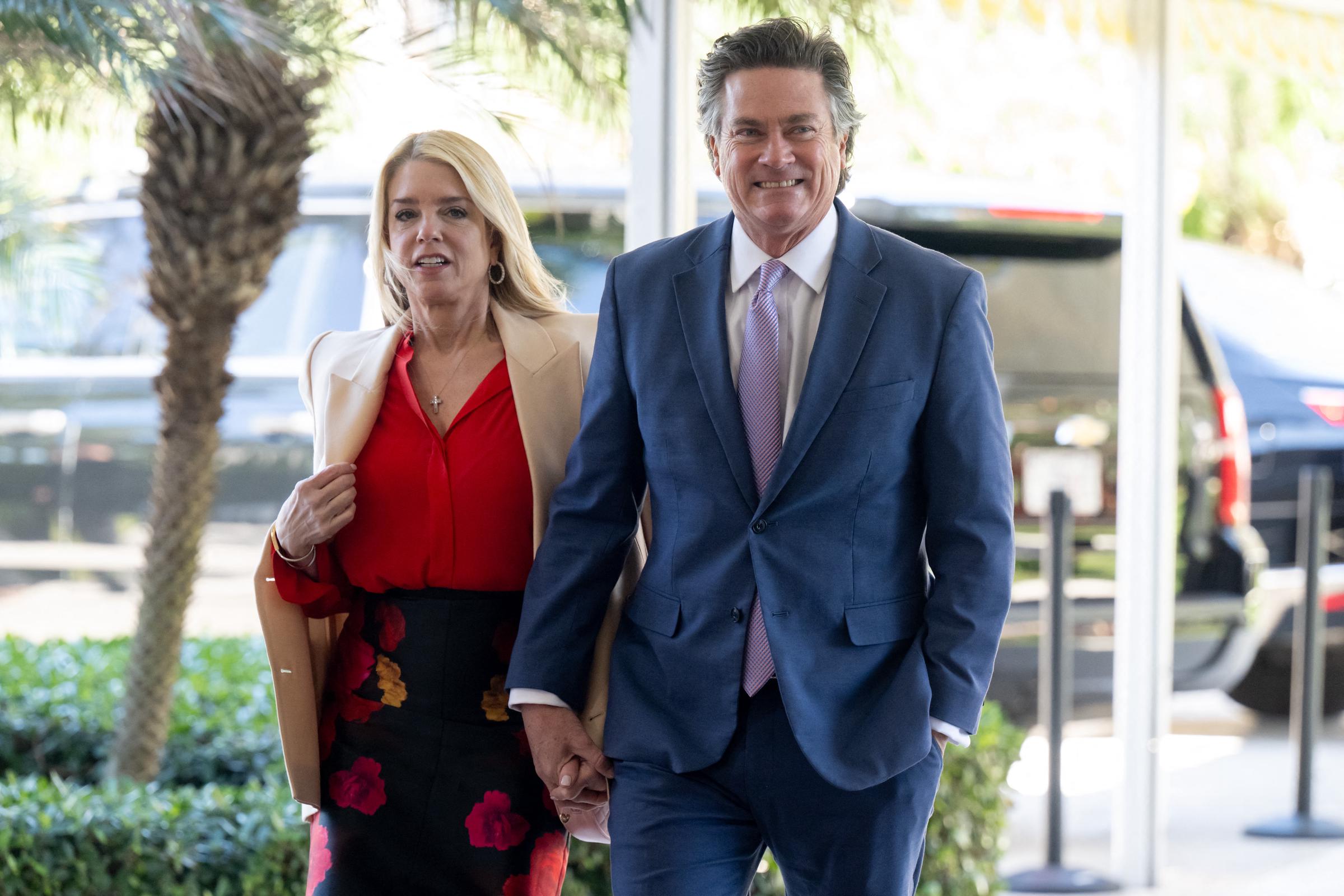 Pam Bondi and John Wakefield arrive at the wedding of Dan Scavino and Erin Elmore at Mar-a-Lago in Palm Beach, Florida, February 1, 2026