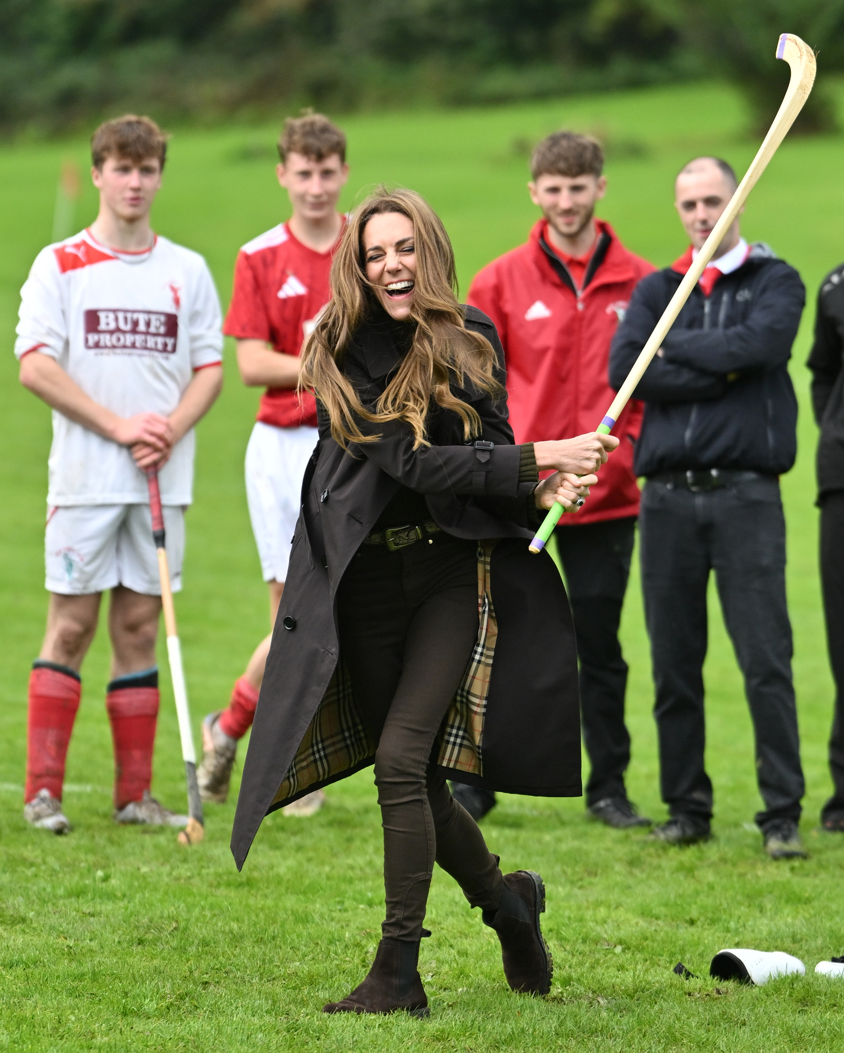 Catherine got a firsthand taste of shinty as club members watched from the field. Her turn with the caman brought a lighthearted element to the couple's first engagement in Rothesay. | Source: Getty Images