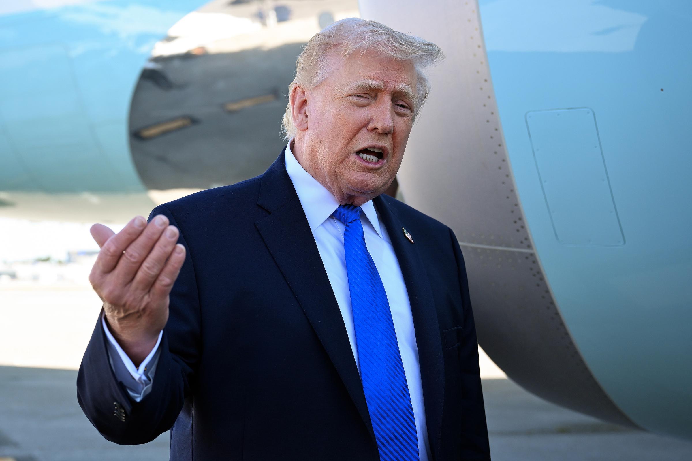 U.S. President Donald Trump speaking to reporters before boarding Air Force One in West Palm Beach, Florida on March 23, 2026. | Source: Getty Images