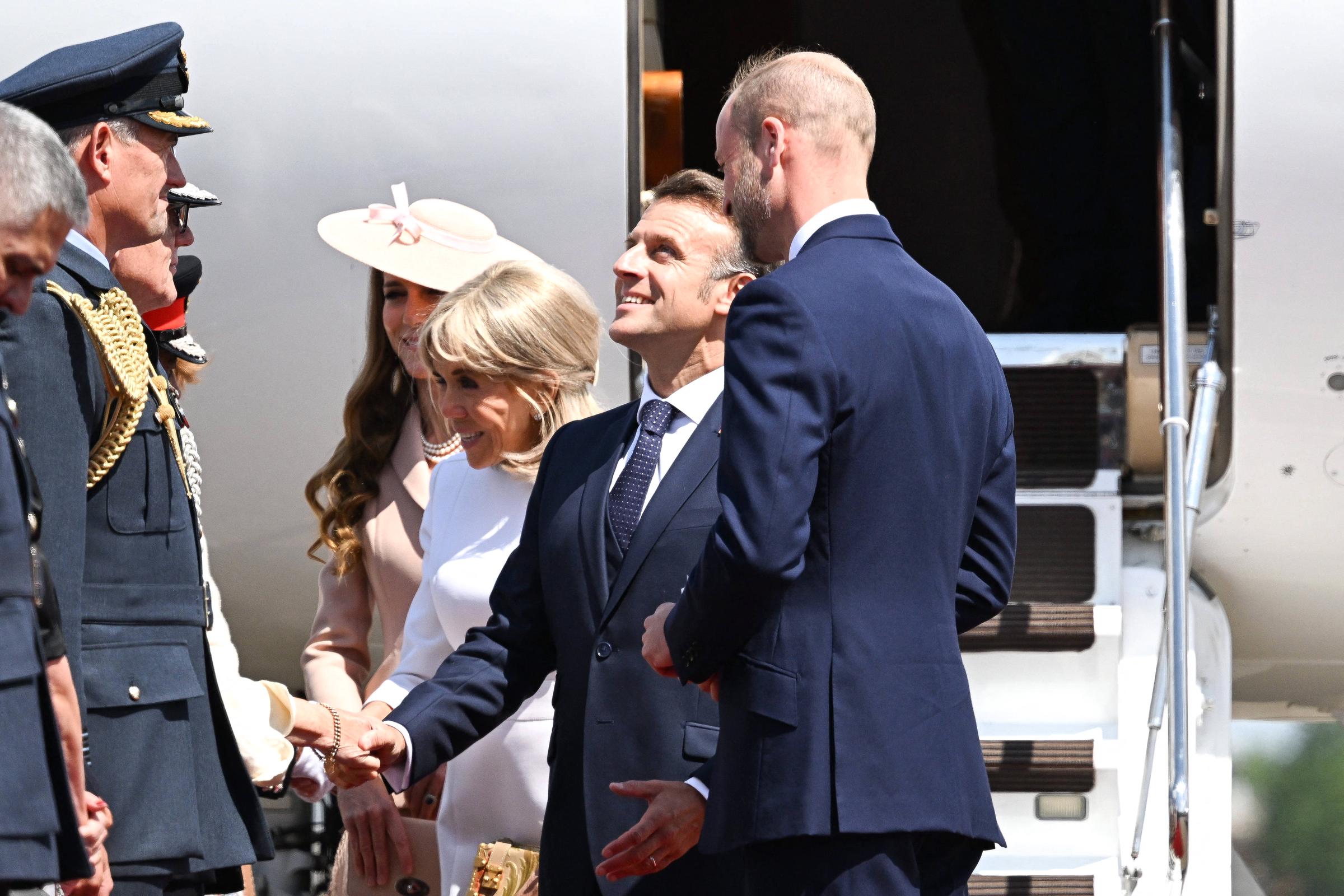 Emmanuel and Brigitte Macron greet the welcoming party as they arrive in Britain for their three-day visit on July 8, 2025 | Source: Getty Images