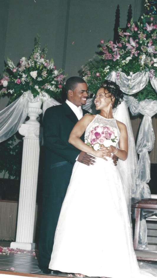 Erica Campbell and Warryn Campbell sharing a joyful moment in a throwback wedding photo celebrating the strength and growth of their marriage. | Source: Instagram/imericacampbell