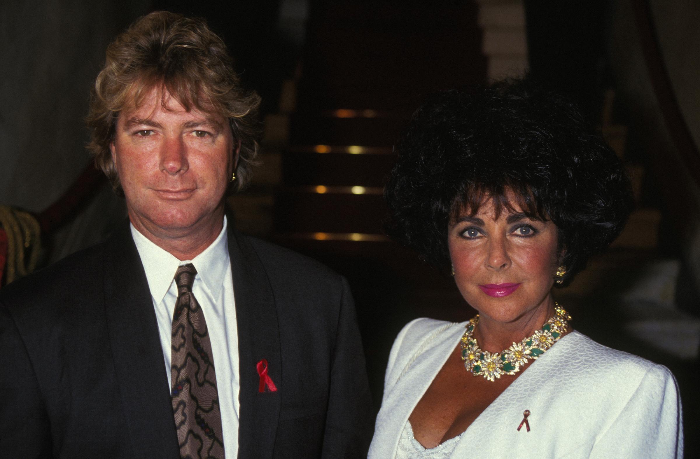 Elizabeth Taylor, with her husband Larry Fortensky, poses during an anti-AIDS soiree on May 12, 1993, in Venice, Italy | Source: Getty Images