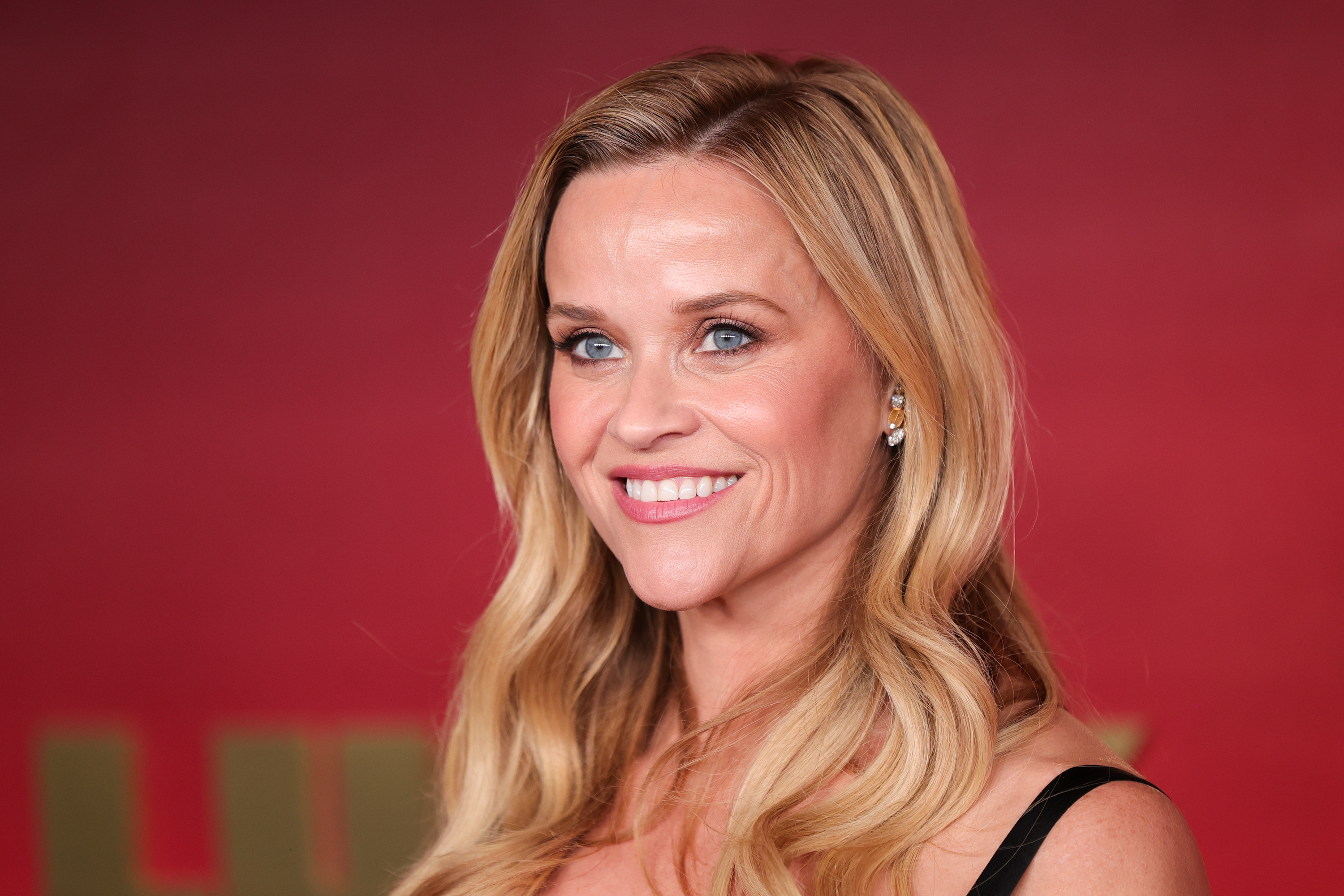 Reese Witherspoon attends the Los Angeles premiere of Apple TV’s "Lucky" on July 13, 2026, as netizens compare Deacon Phillippe's features with hers. | Source: Getty Images