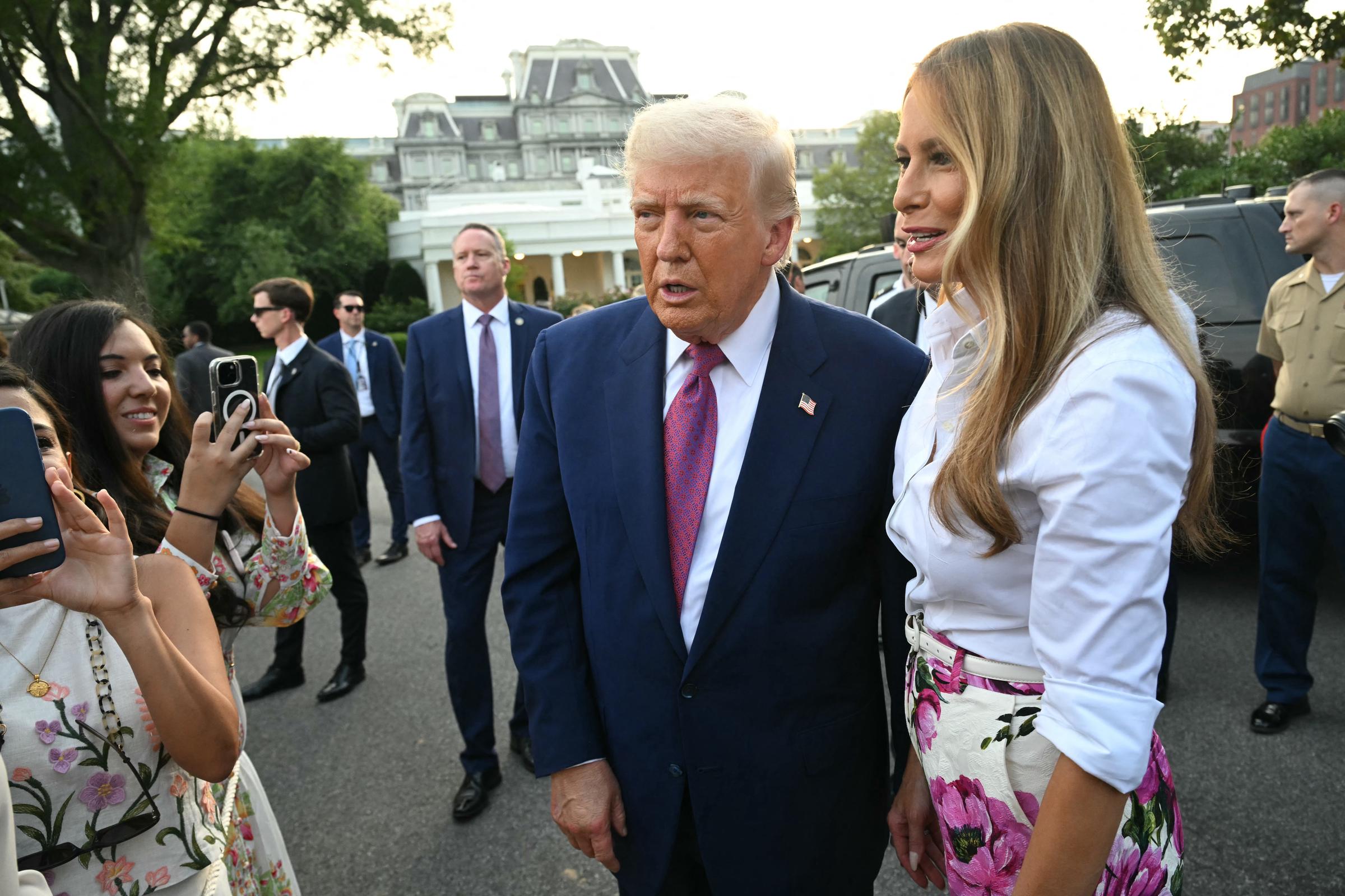 Donald and Melania Trump greet attendees as they arrive at the Congressional Picnic on the South Lawn of the White House on June 12, 2025 in Washington, DC | Source: Getty Images