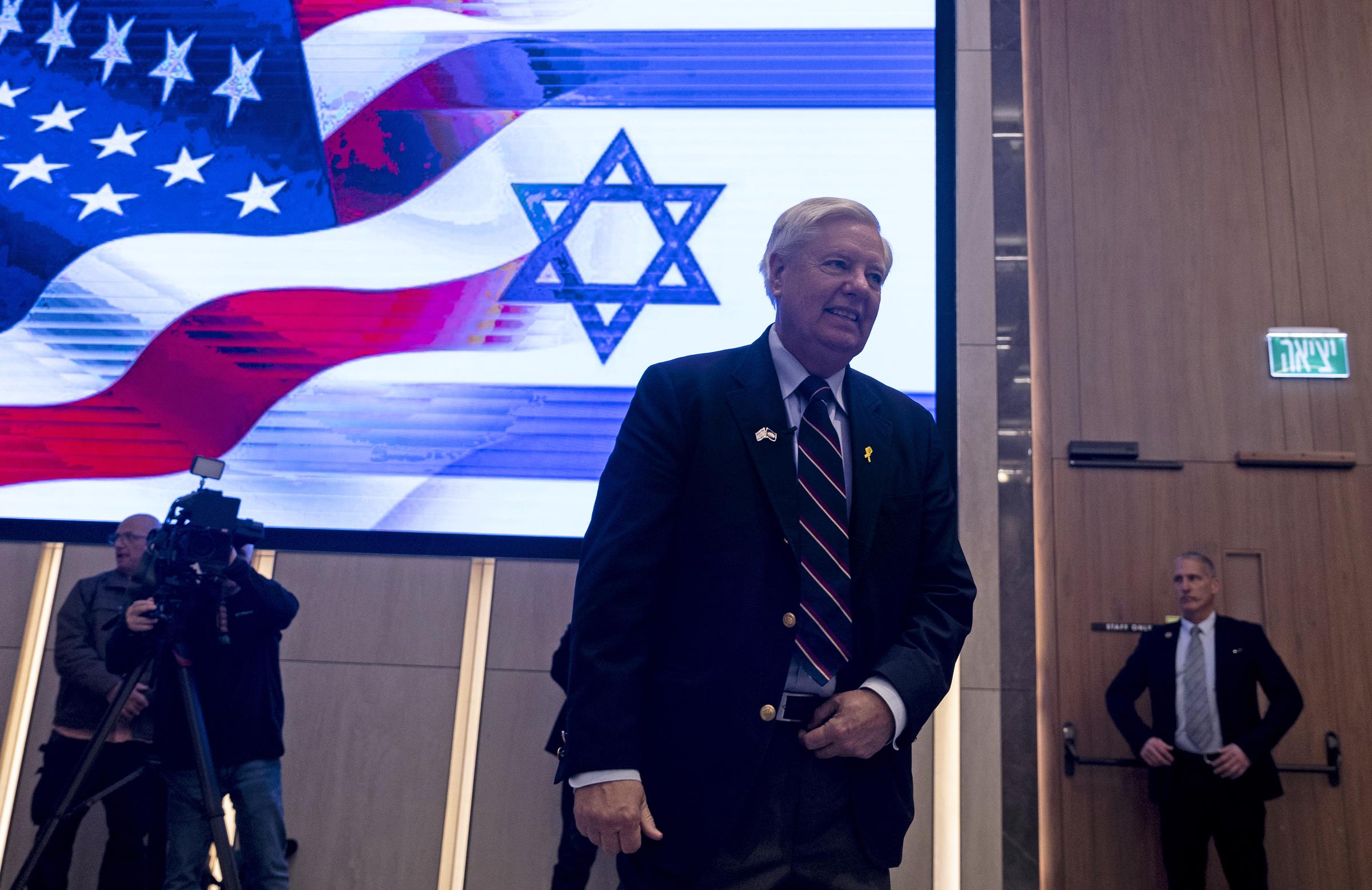 Lindsey Graham arrives for a press conference in Tel Aviv, joining a bipartisan congressional delegation as discussions focus on the enduring partnership between the United States and Israel. | Source: Getty Images