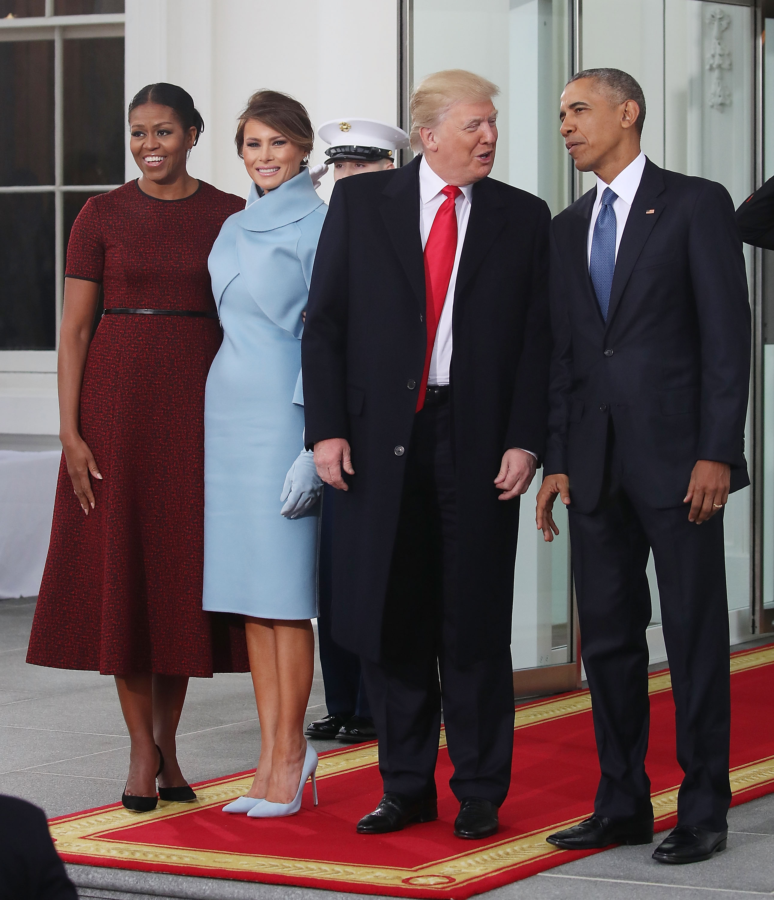 Incoming First Lady Melania Trump arrives at the White House on Inauguration Day, January 20, 2017, greeted alongside President-elect Donald Trump by President Barack Obama and First Lady Michelle Obama before the swearing-in ceremony at the U.S. Capitol. Wearing a custom powder-blue Ralph Lauren cashmere dress with a sculptural mock-neck bolero and matching suede gloves, she anchors the monochrome look with matching pale blue suede pointed-toe pumps that elongate her silhouette with towering stiletto heels.
