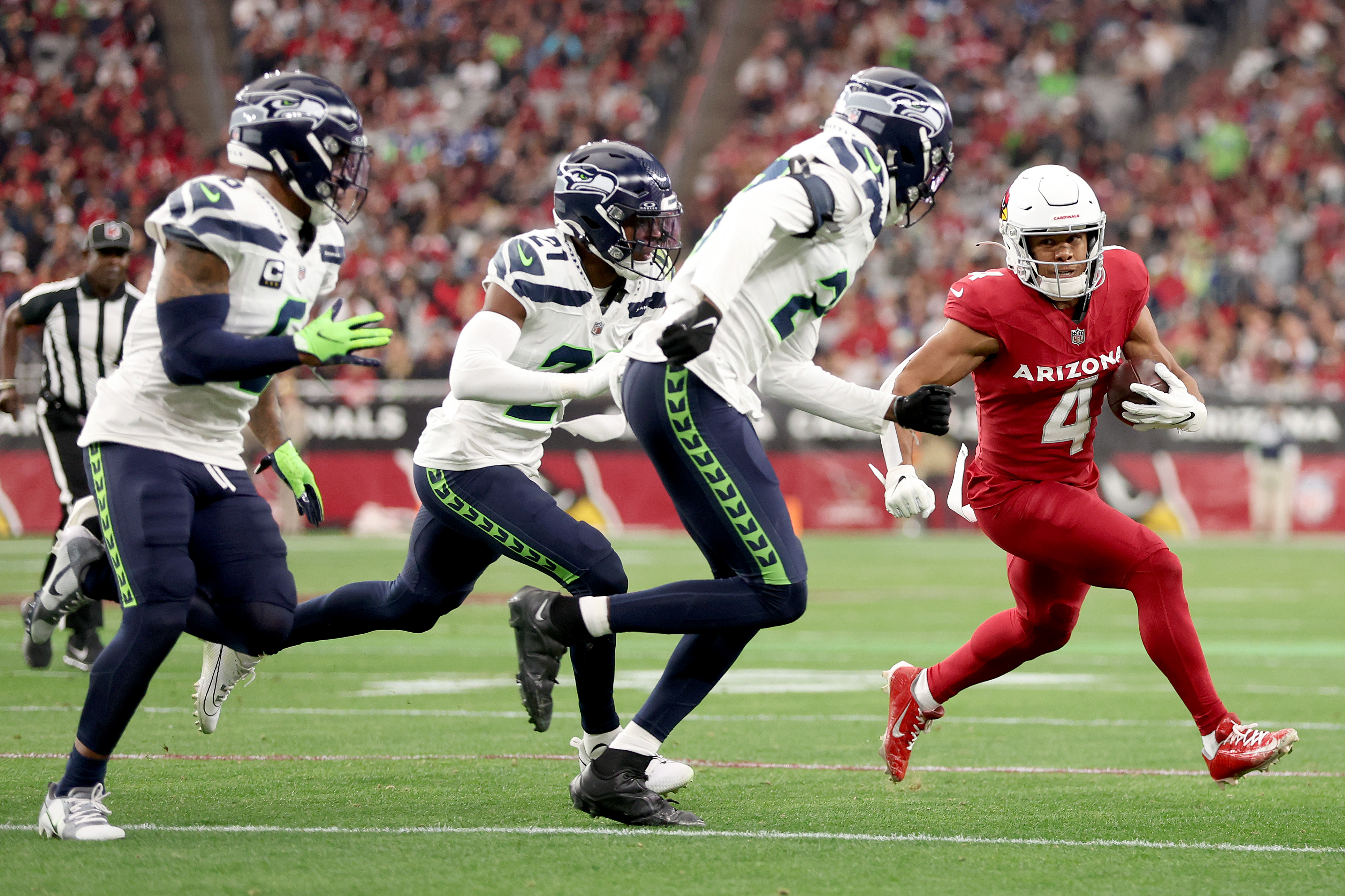 Rondale Moore of the Arizona Cardinals runs with the ball during the first half against the Seattle Seahawks at State Farm Stadium on January 7, 2024, in Glendale, Arizona | Source: Getty Images