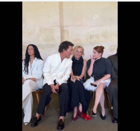 Alves gazes ahead with a composed expression as McConaughey and Emma Roberts, seated on opposite sides of Gillian Anderson, dive into a lively conversation. Roberts reacts with a dramatic, wide-eyed expression, seemingly surprised, while McConaughey appears equally animated, suggesting the two were sharing a humorous moment. | Source: Tiktok/@jacquemus